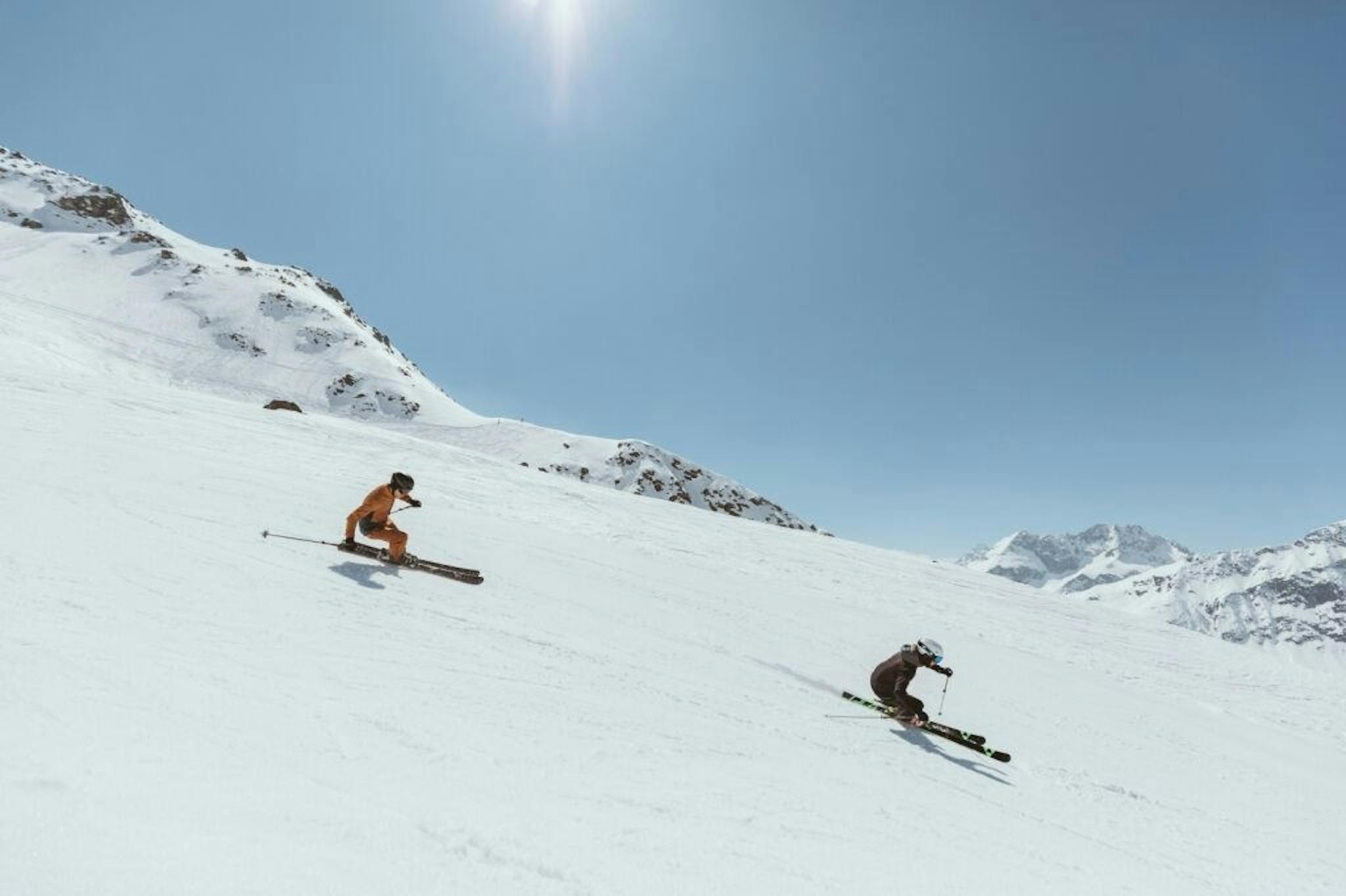 Skiers skiing down mountain in St. Anton, Austria. 