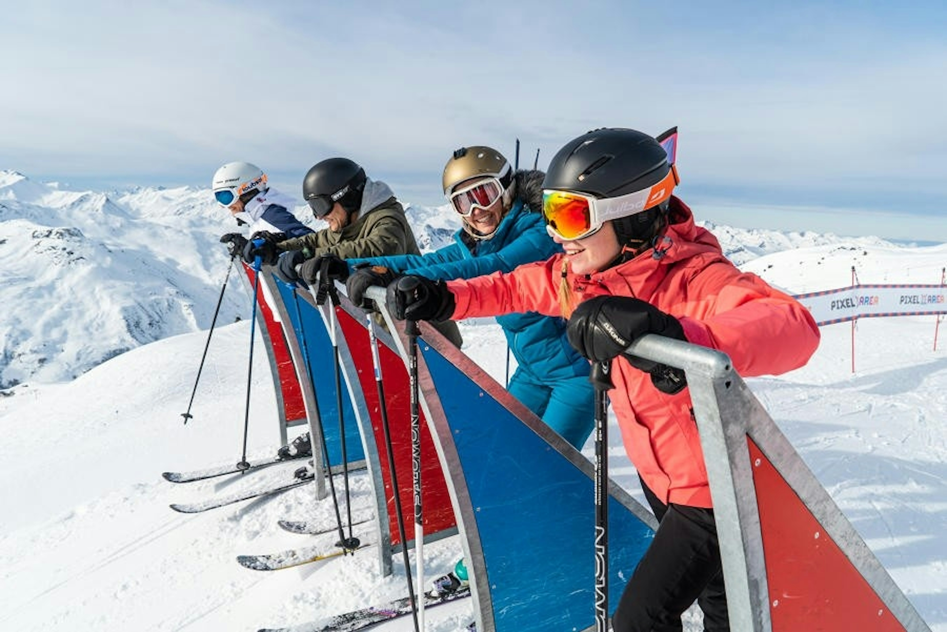 A group of skiers gathered on a snowy slope, ready to hit the slopes and enjoy a day of skiing together.