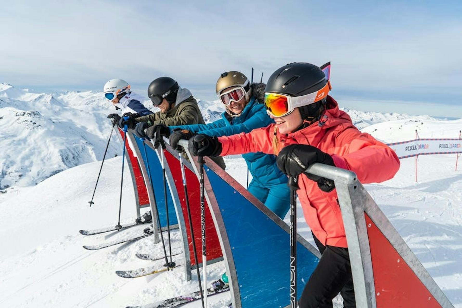 Skiers ready to race down the hill in Les Menuires