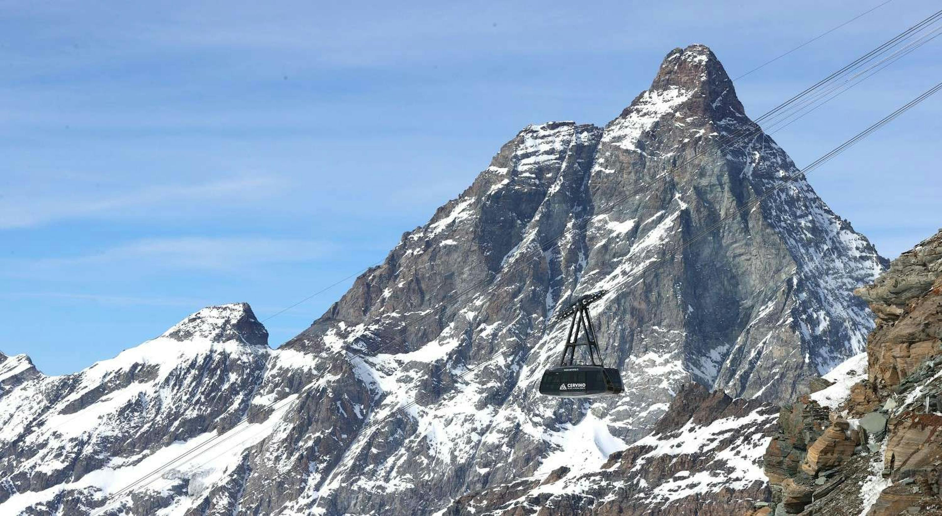 Tram goes past the Matterhorn at Cervinia, Italy. 