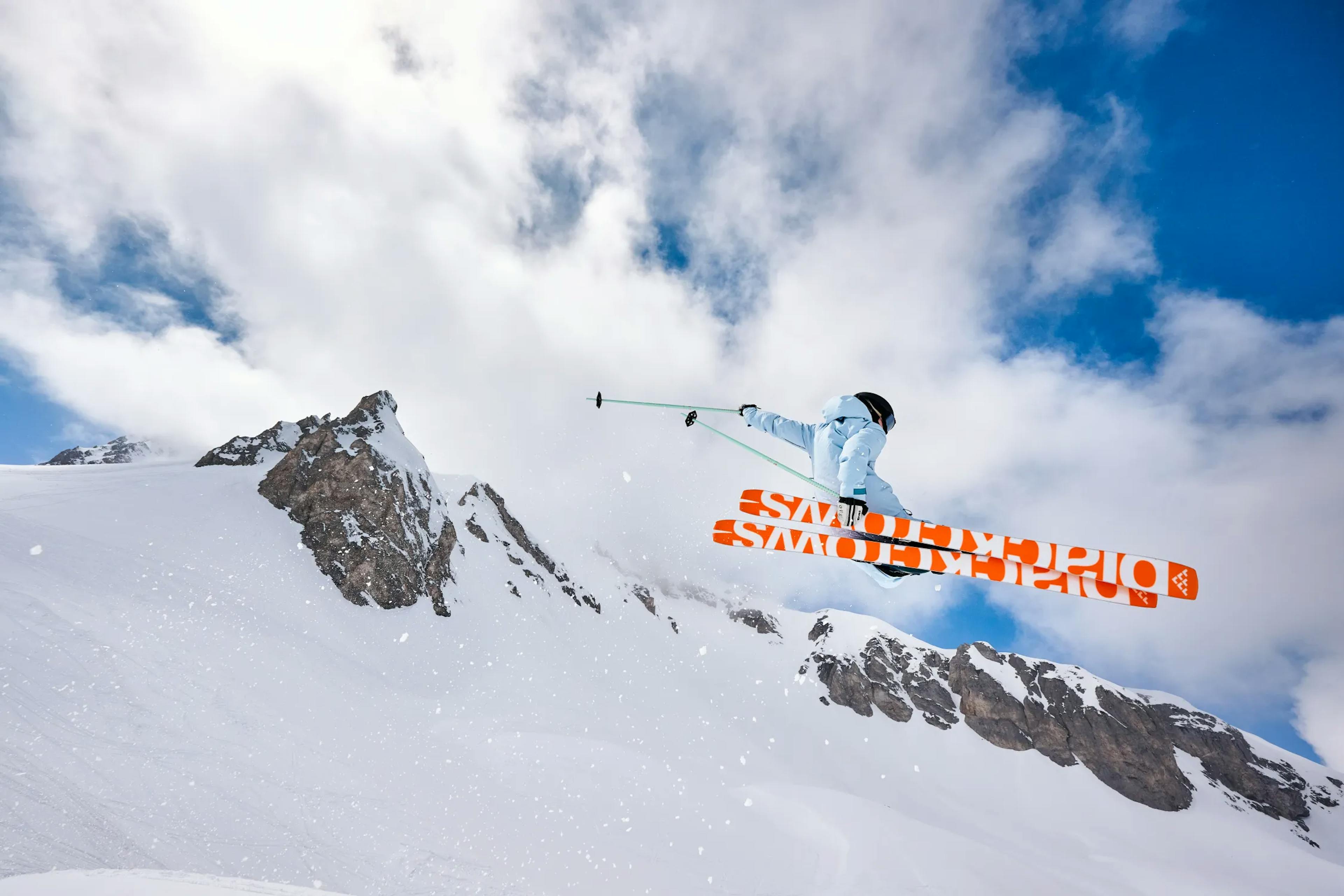 Skier jumping off a cliff.