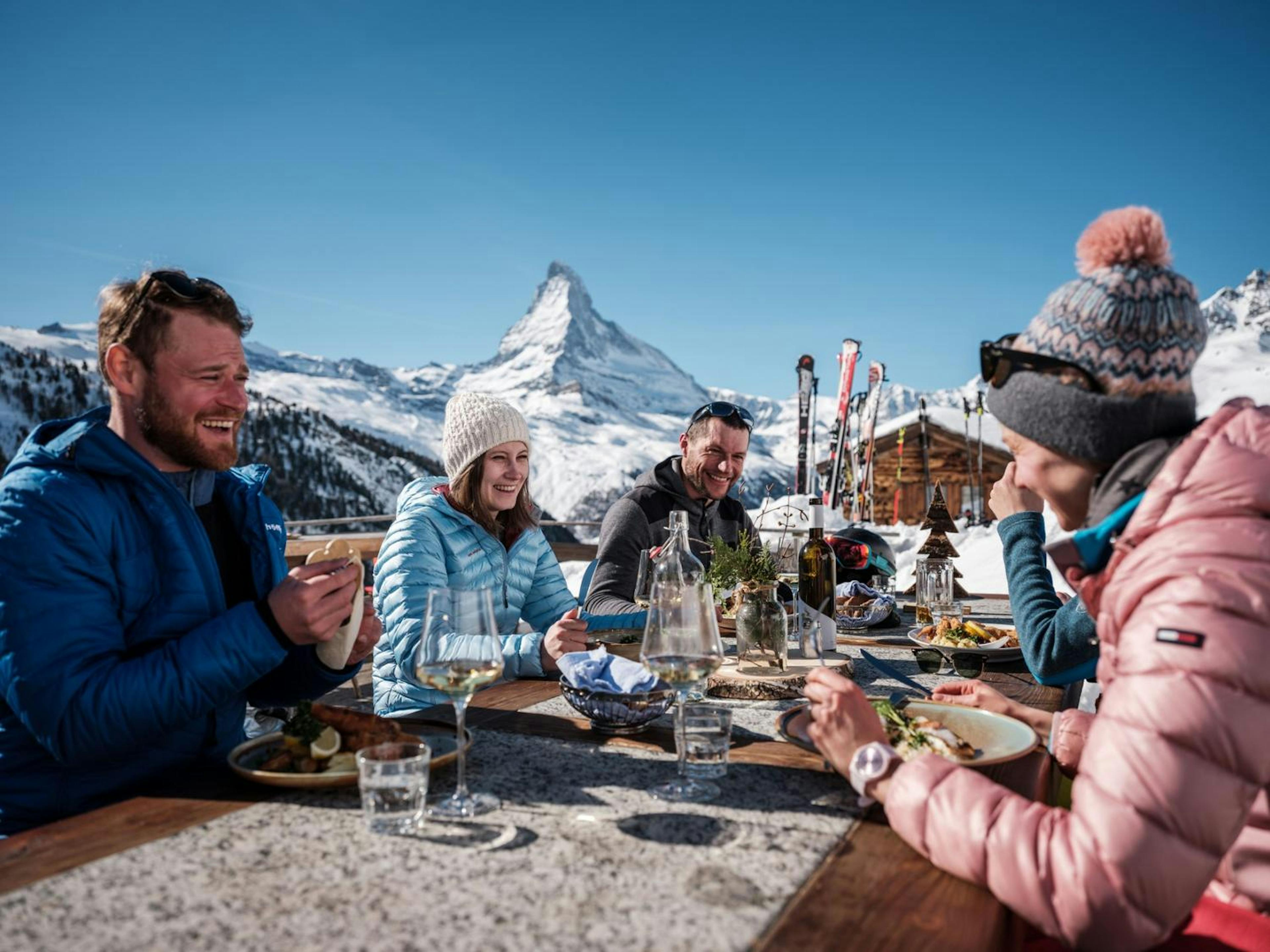 A group of friends enjoying apres ski at Zermatt