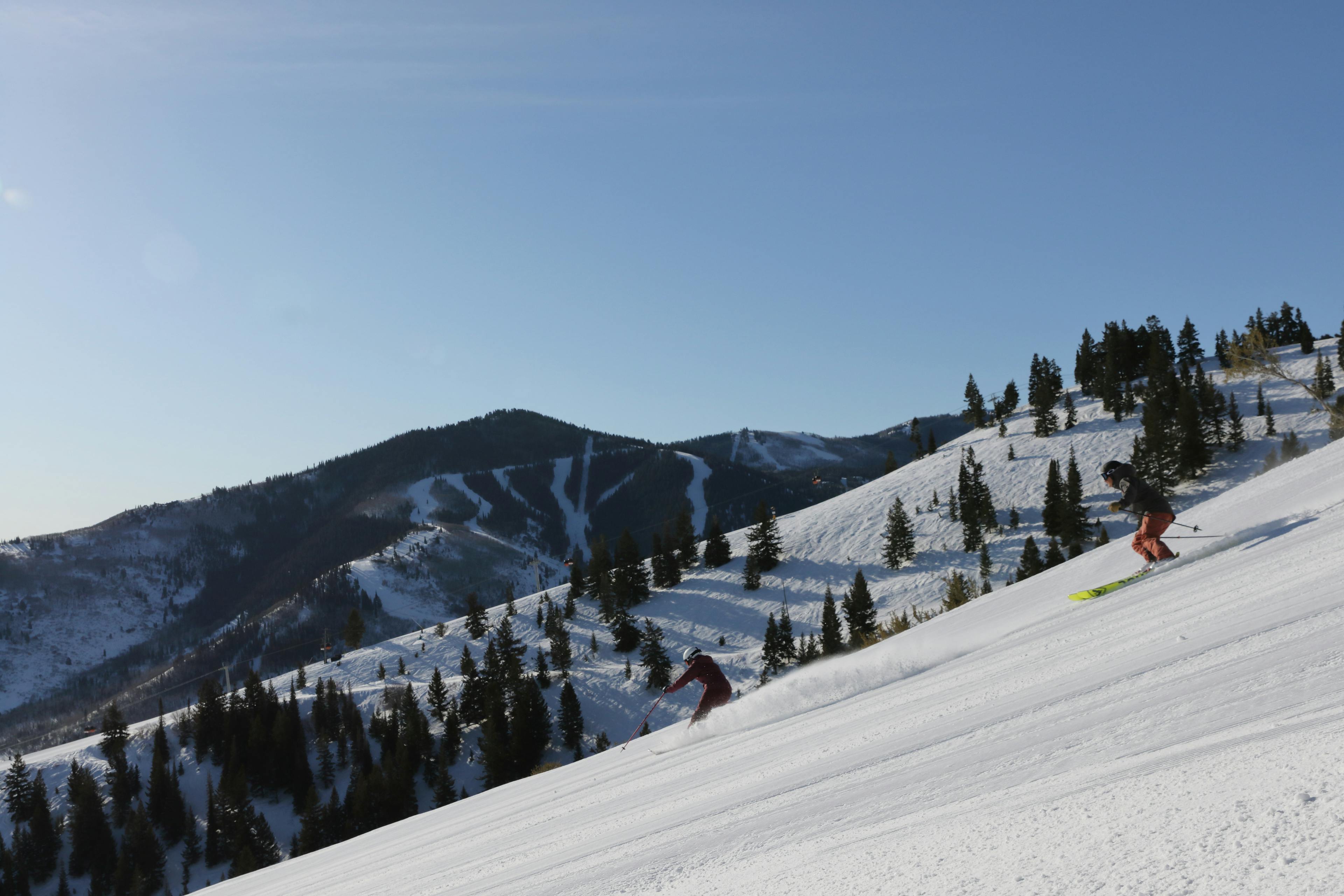 Female skier hitting the slopes at the very ski-in ski-out friendly Park City Mountain Resort.