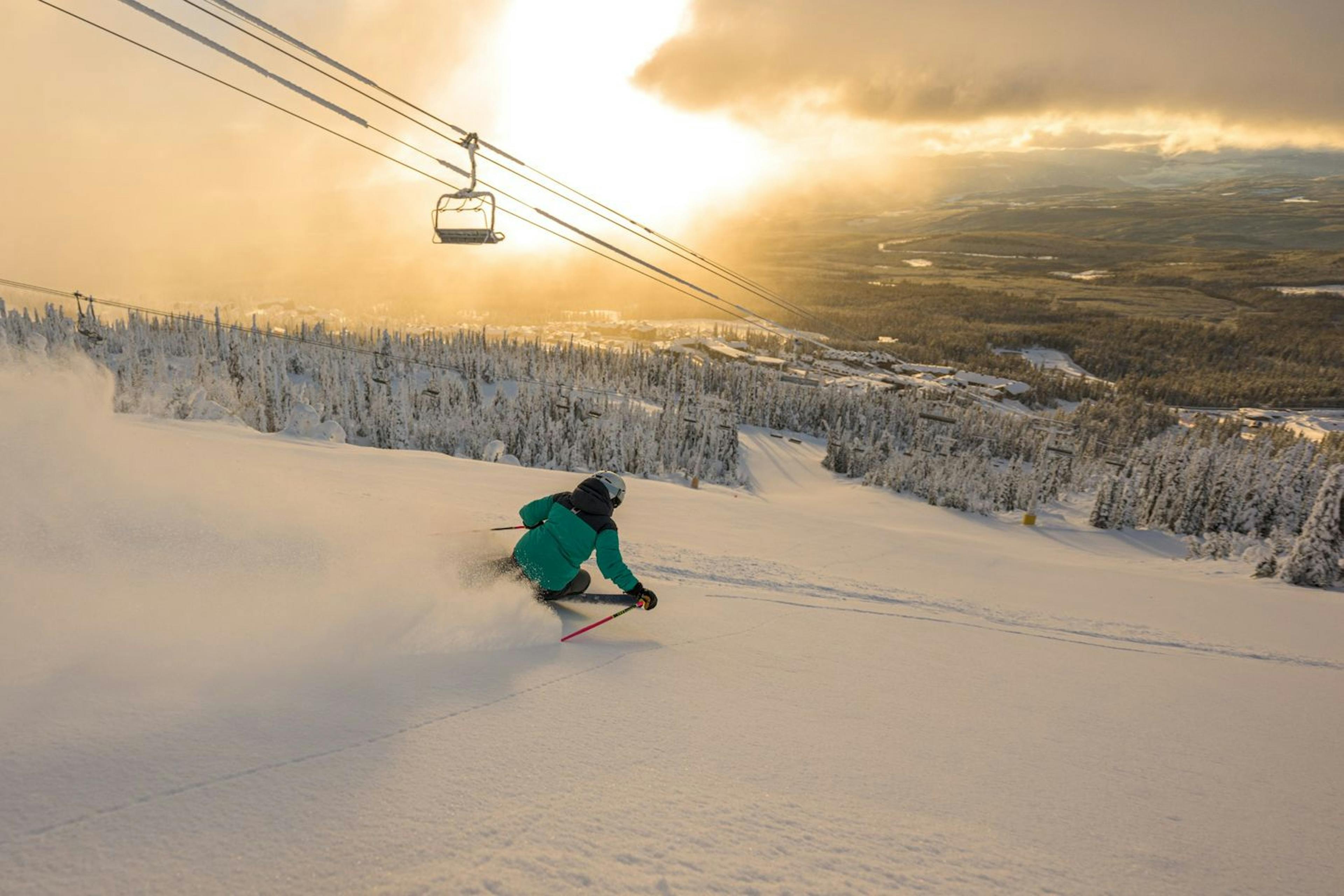 A skier goes down a snowy slope at Big White Ski Resort