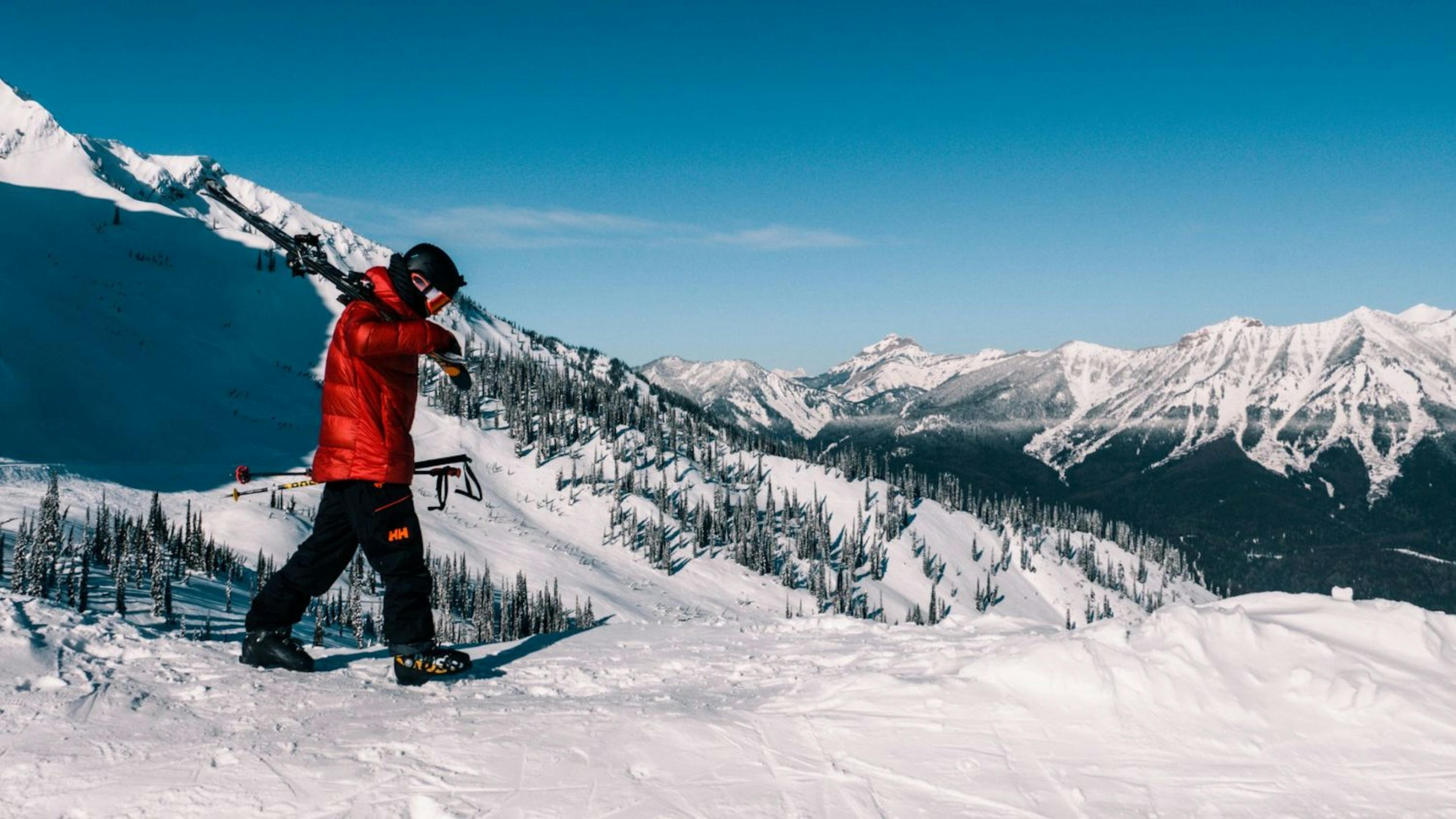 A skier stands on a snow-covered mountain at Fernie Alpine Resort