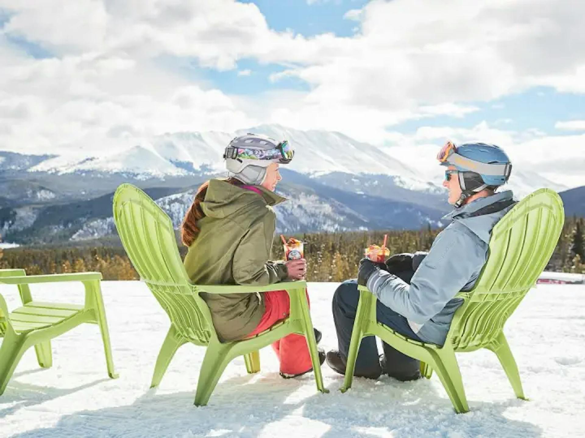 Two women skiers chatting on the slopes