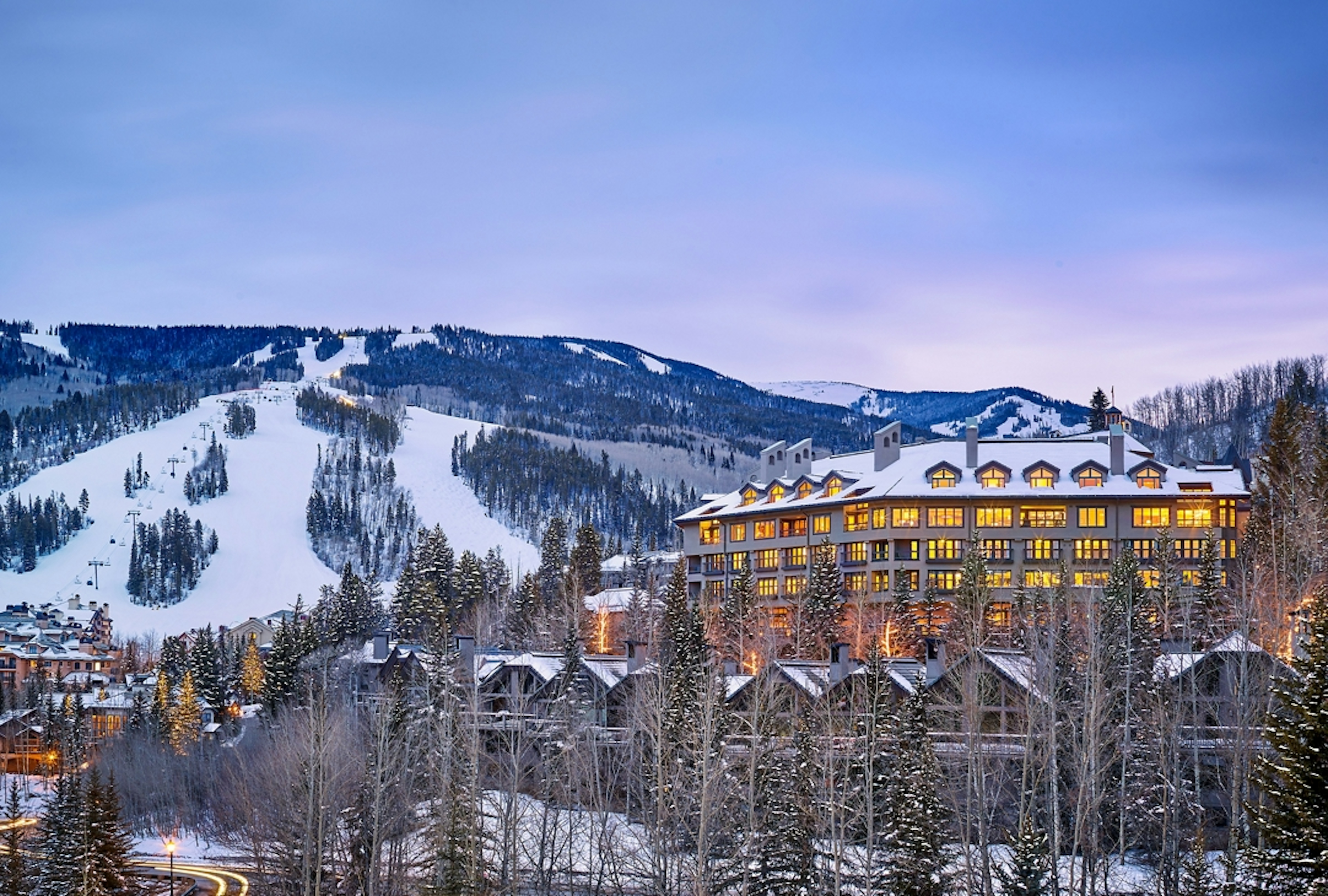 A scenic ski resort nestled in the mountains, showcasing snowy slopes and a majestic mountain backdrop.