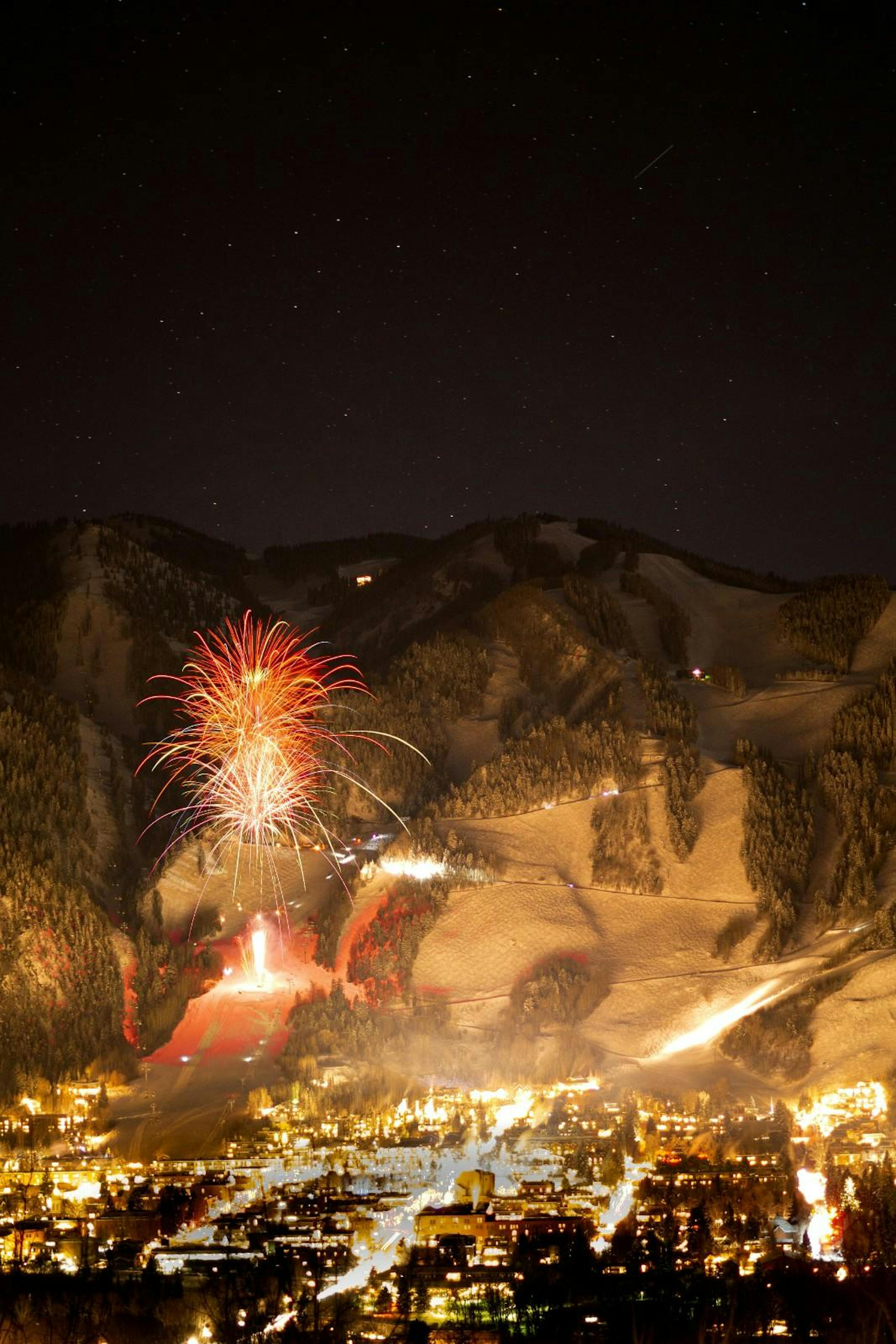 fire works at night above aspen snowmass