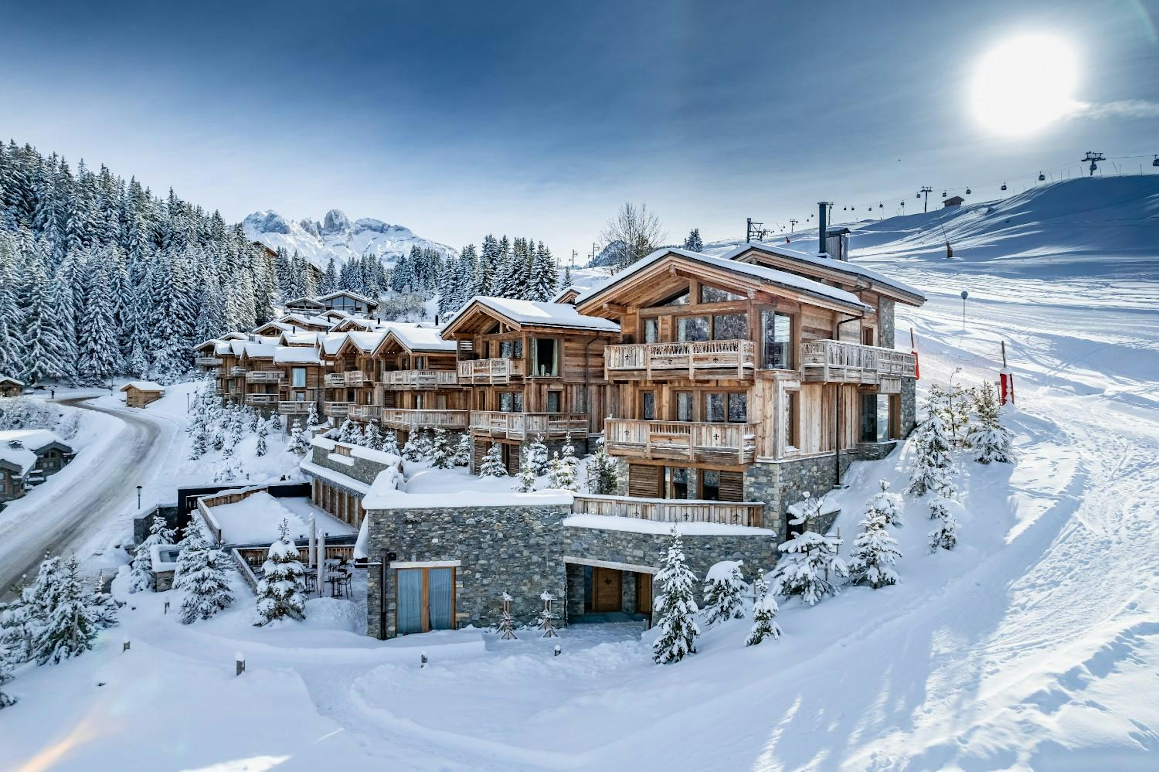 exterior shot of a ski in ski out hotel in Courchevel on a sunny day

