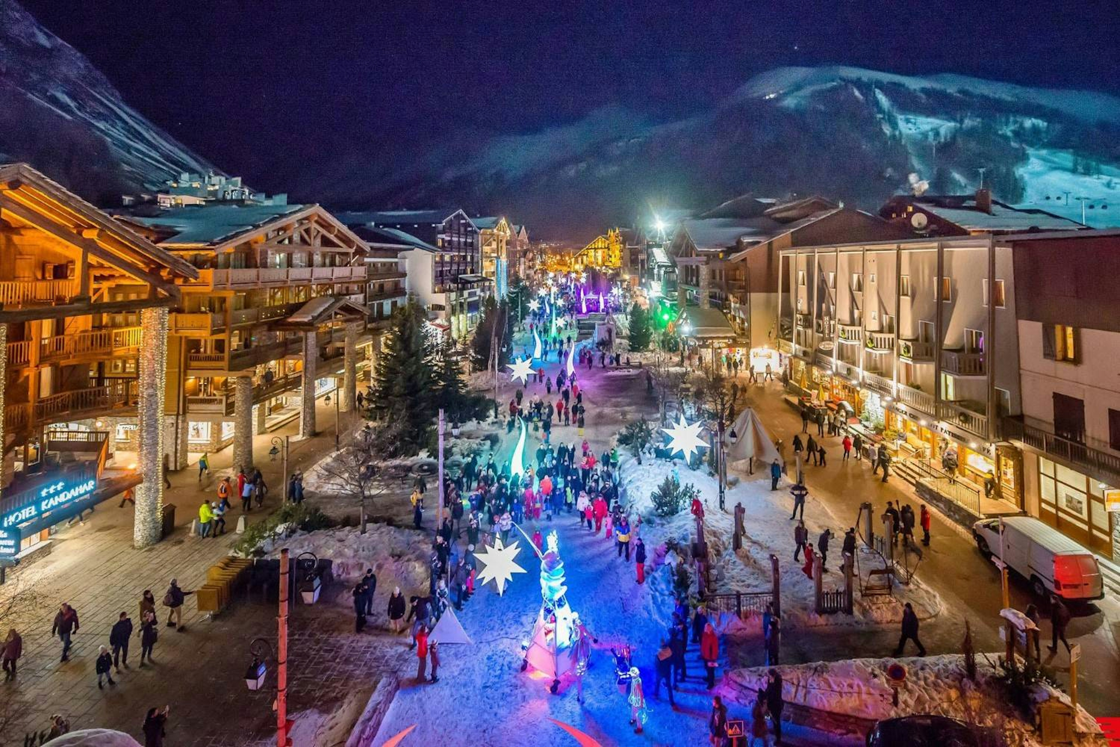 view of val d isere at night with beautiful lights lighting up the street