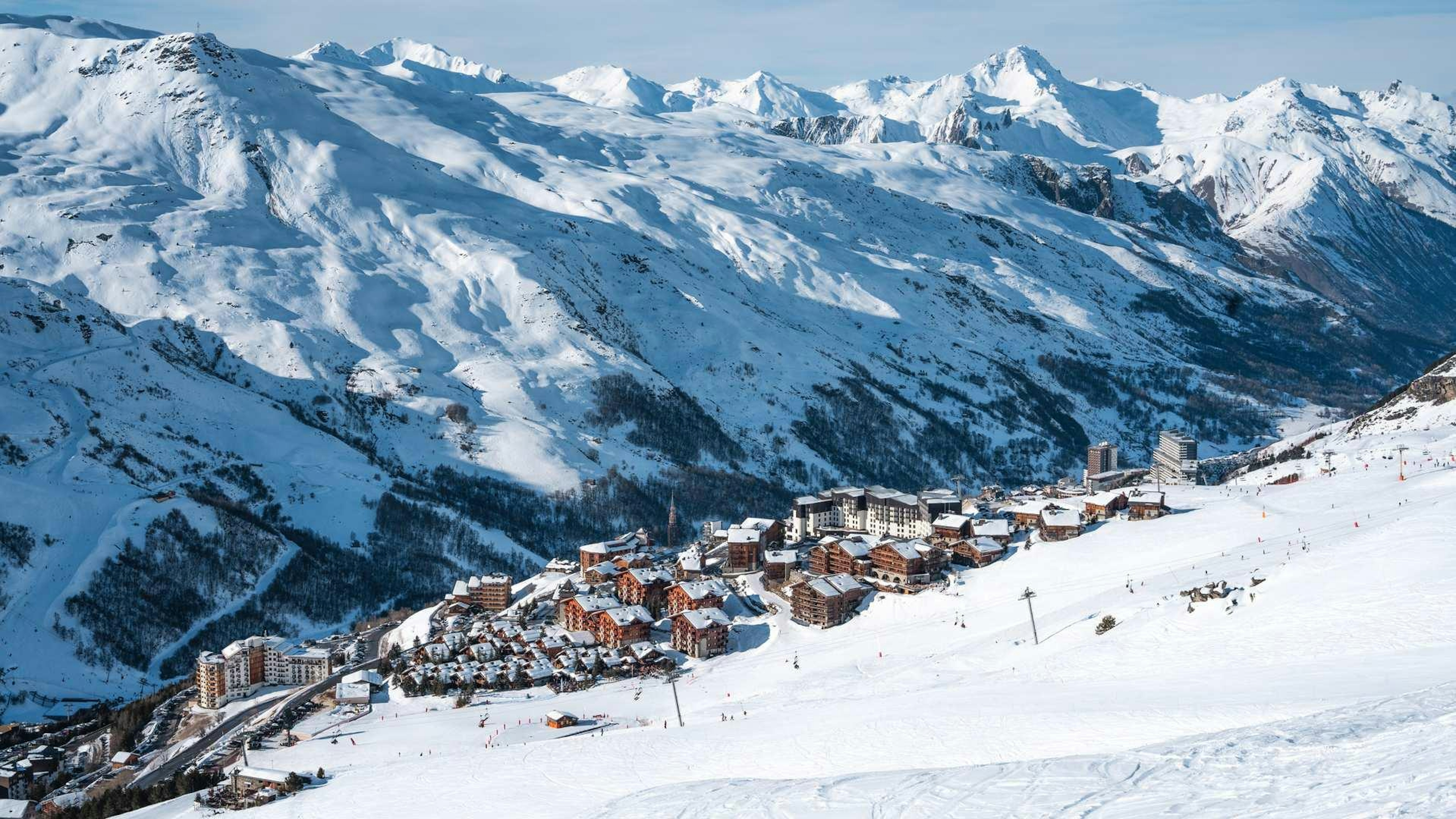 les menuires the town set against mountain peaks

