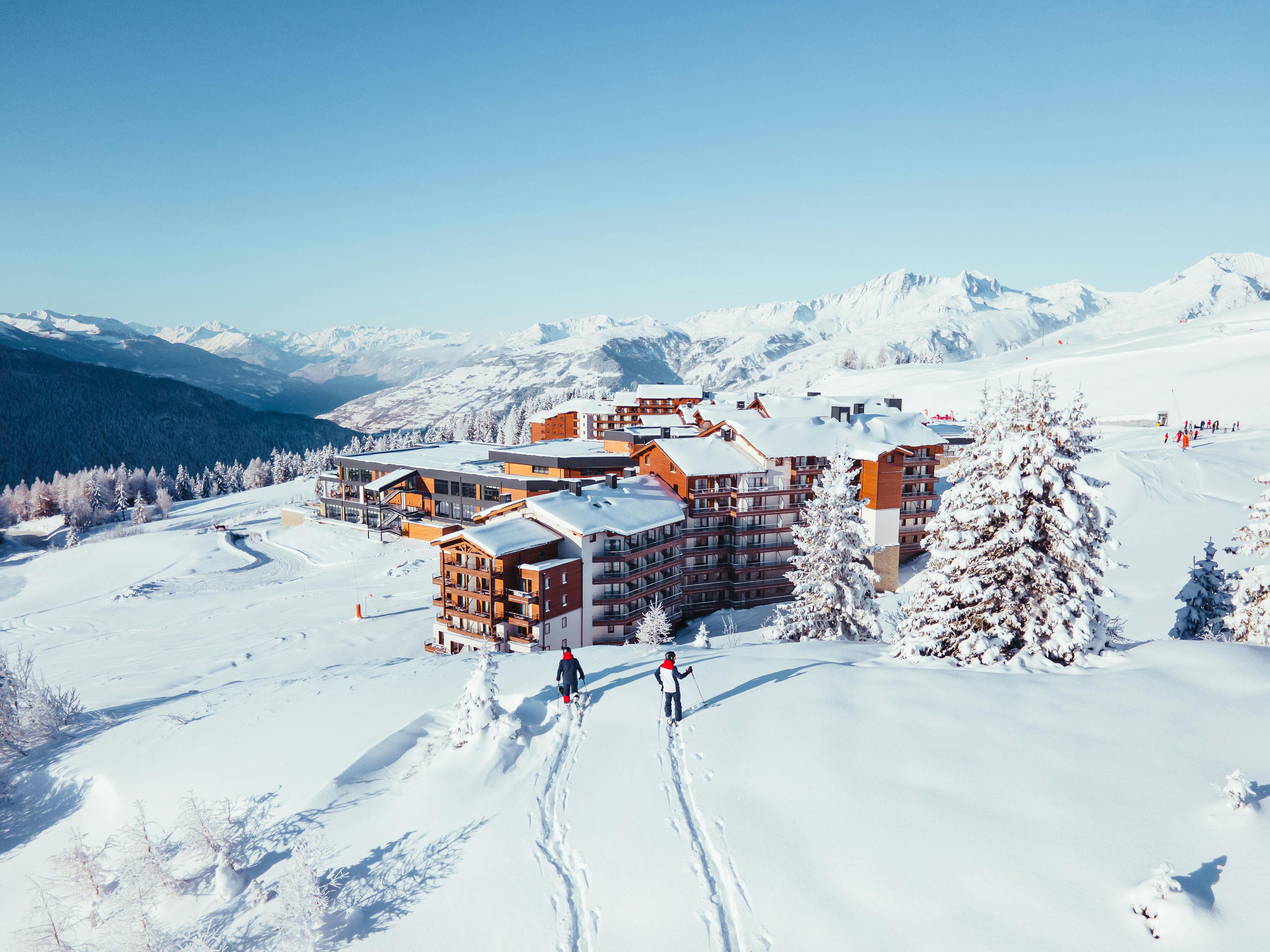 Skiers approaching Club Med La Rosiere