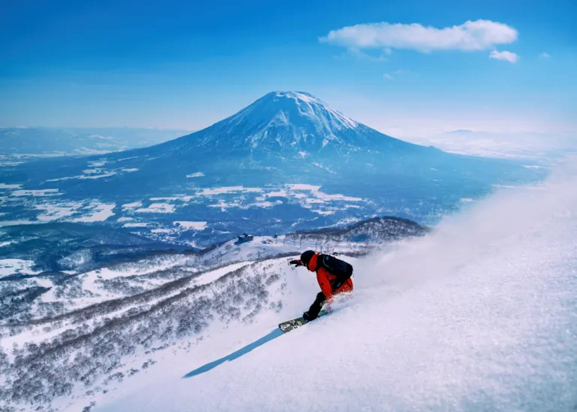 Man snowboarding the slopes in Japan