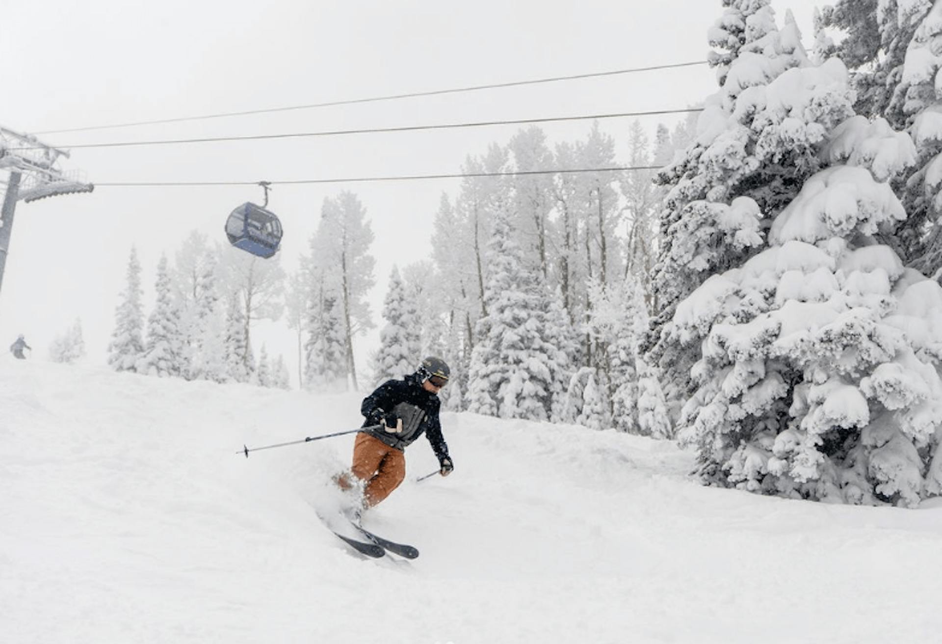 Man in orange trousers skiing in Wyoming