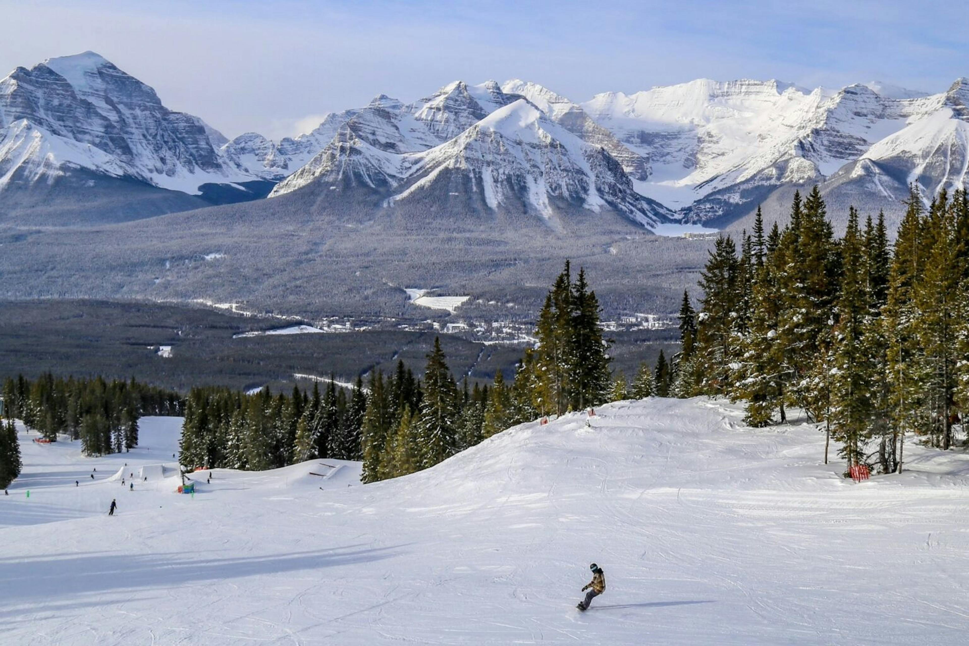 A skier skiing the slope at Banff Lake Louise