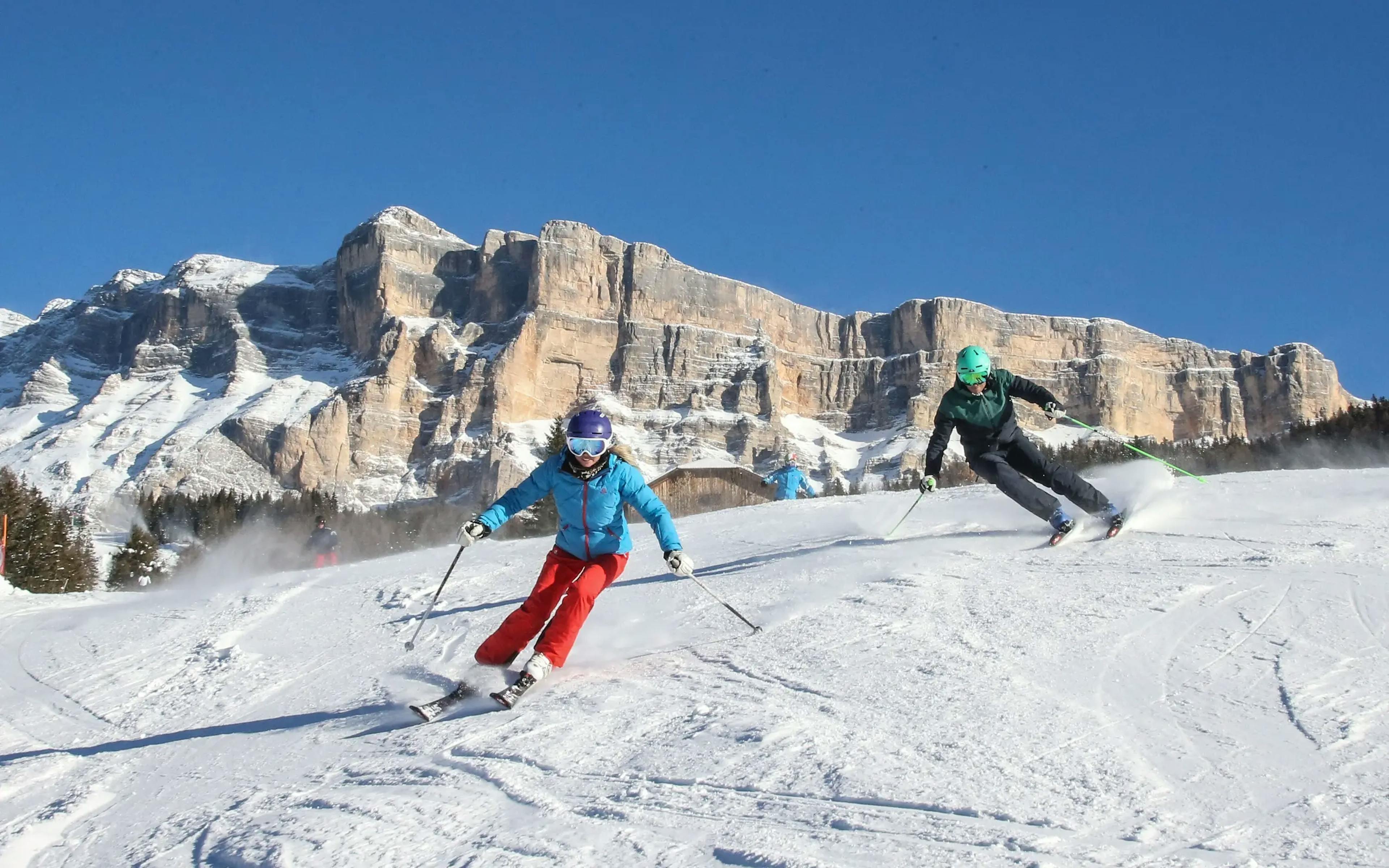 Two skiers enjoying the slopes at Alta Badia