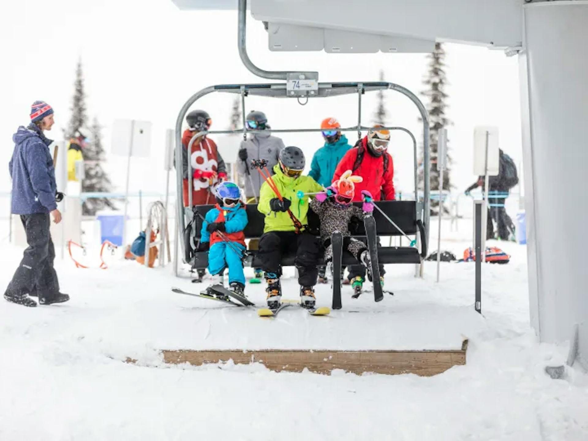 Family on chair lift in Canadian ski resort