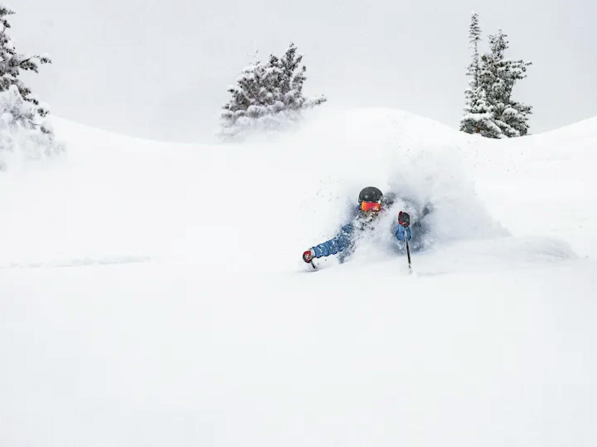 Japanese skier hitting the powder