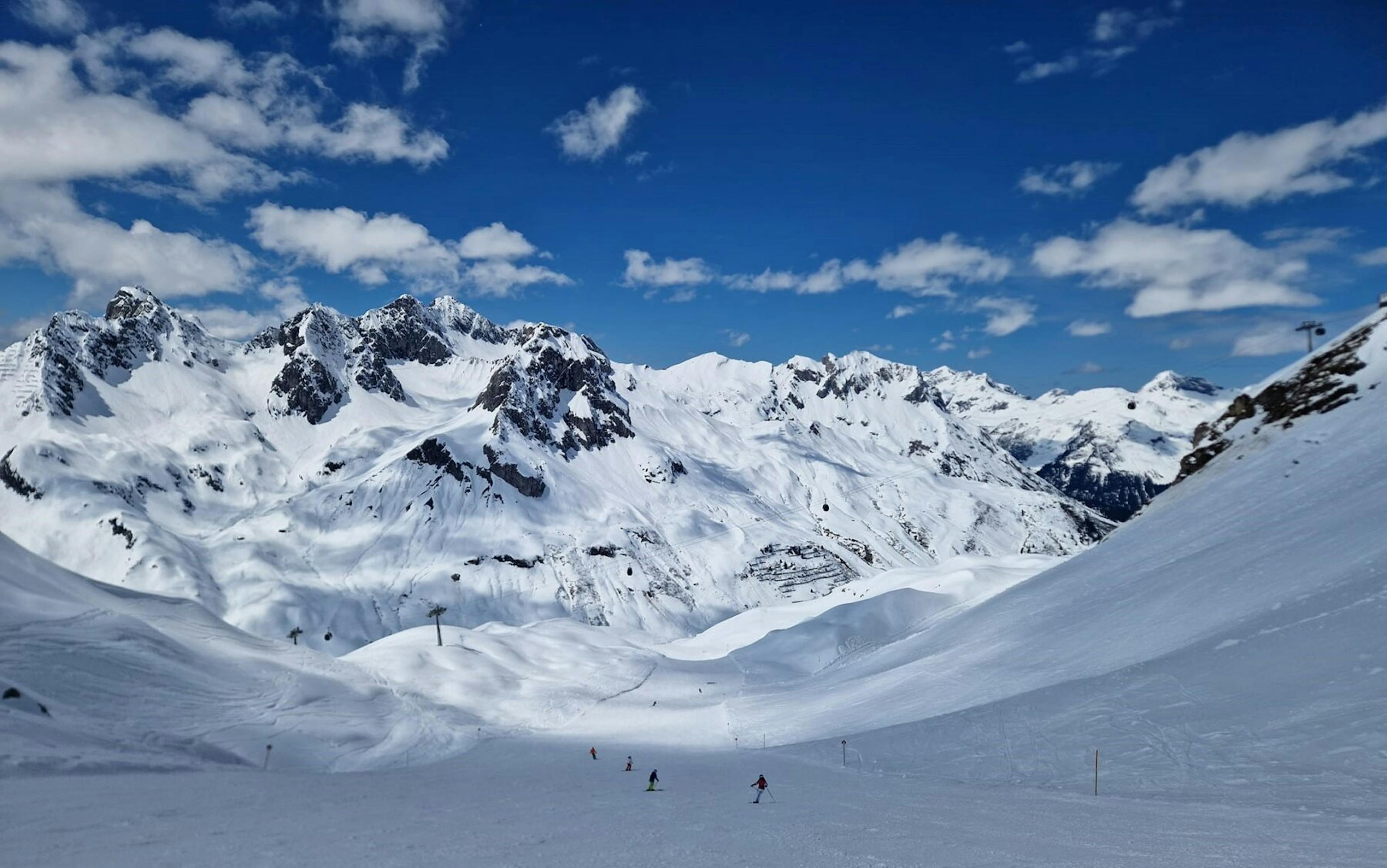 Skiers skiing around the Lech area near Zürs ski resort in Austria