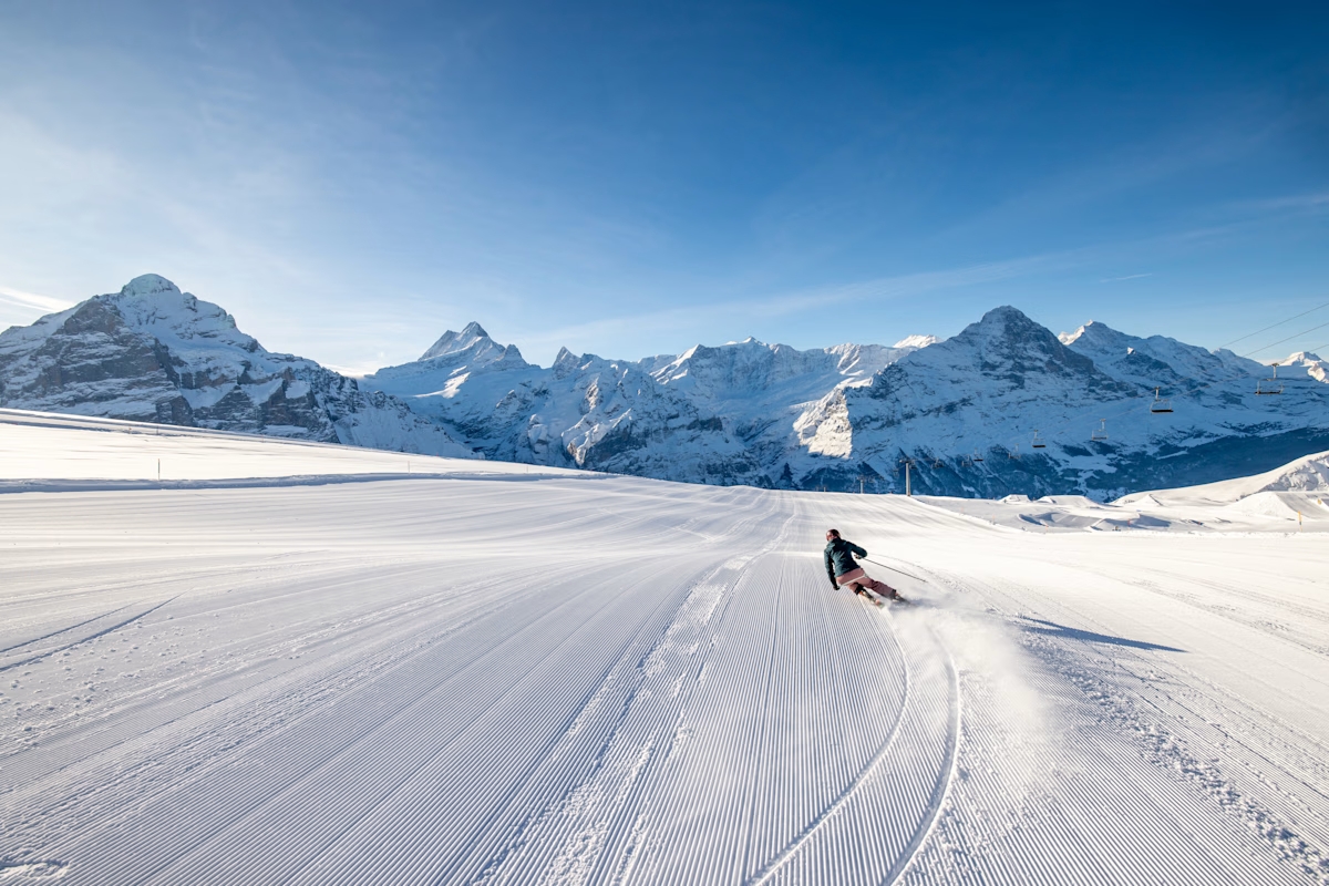 A skier on a groomed trail in Grindelwald