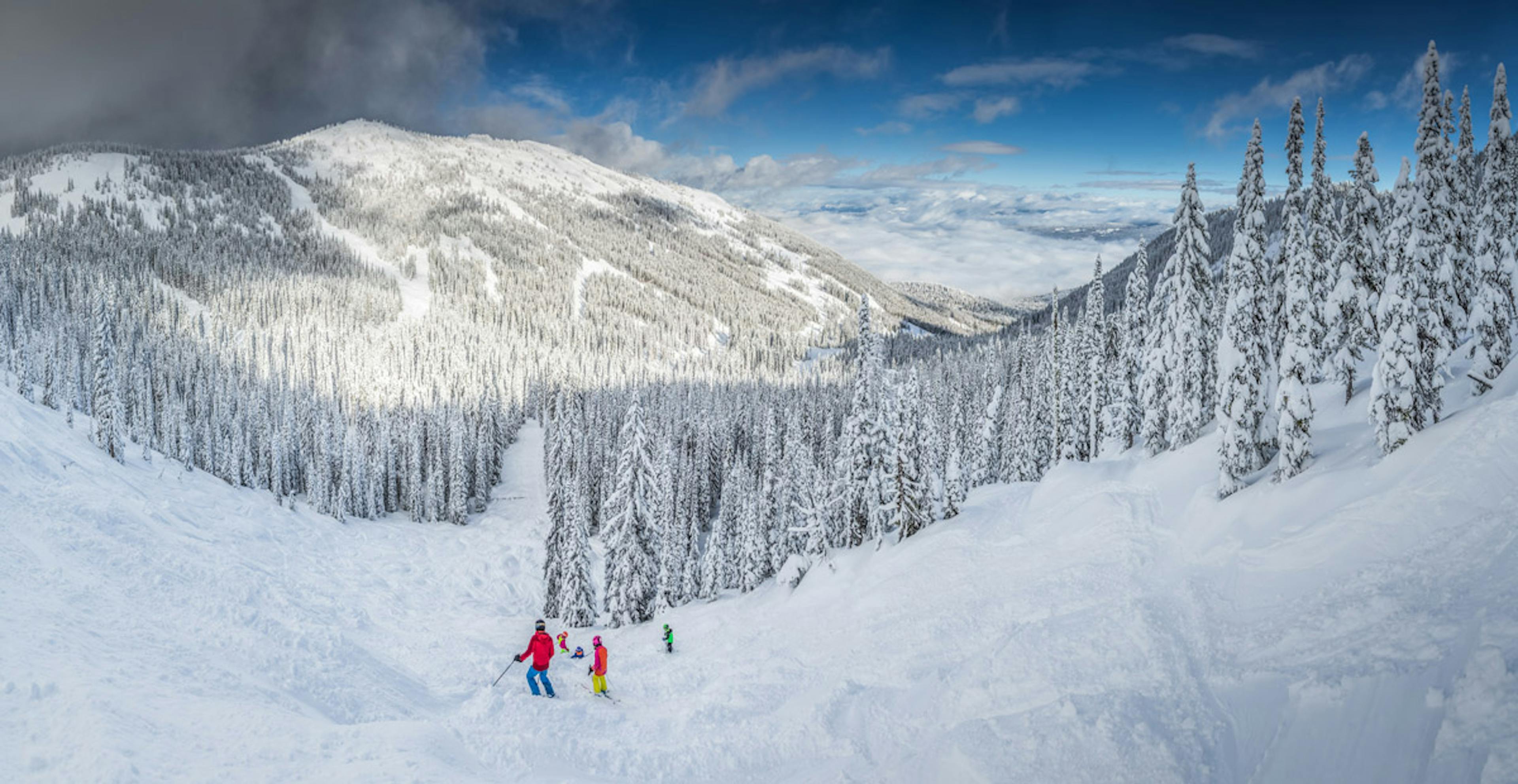 Family on a mogul run at RED Mountain Resort.