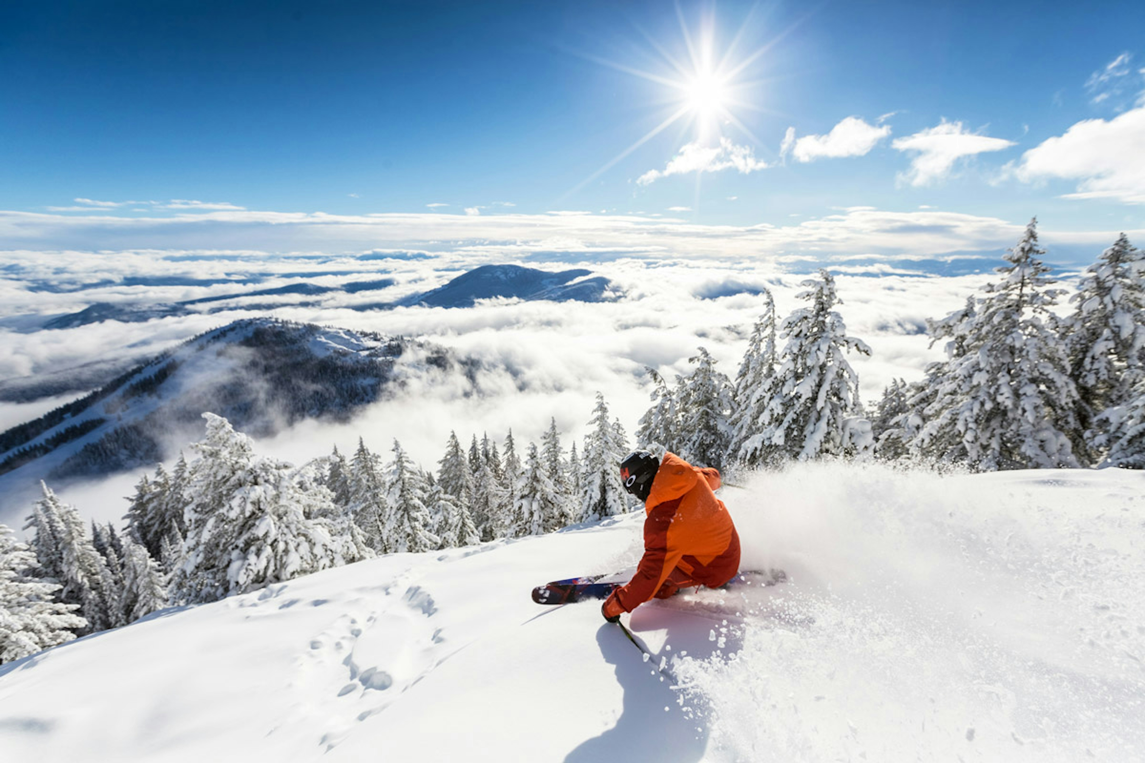 Skier on powder at RED Mountain Resort.