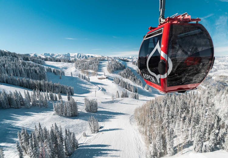 The Silver Queen gondola at Aspen Mountain on a sunny day.