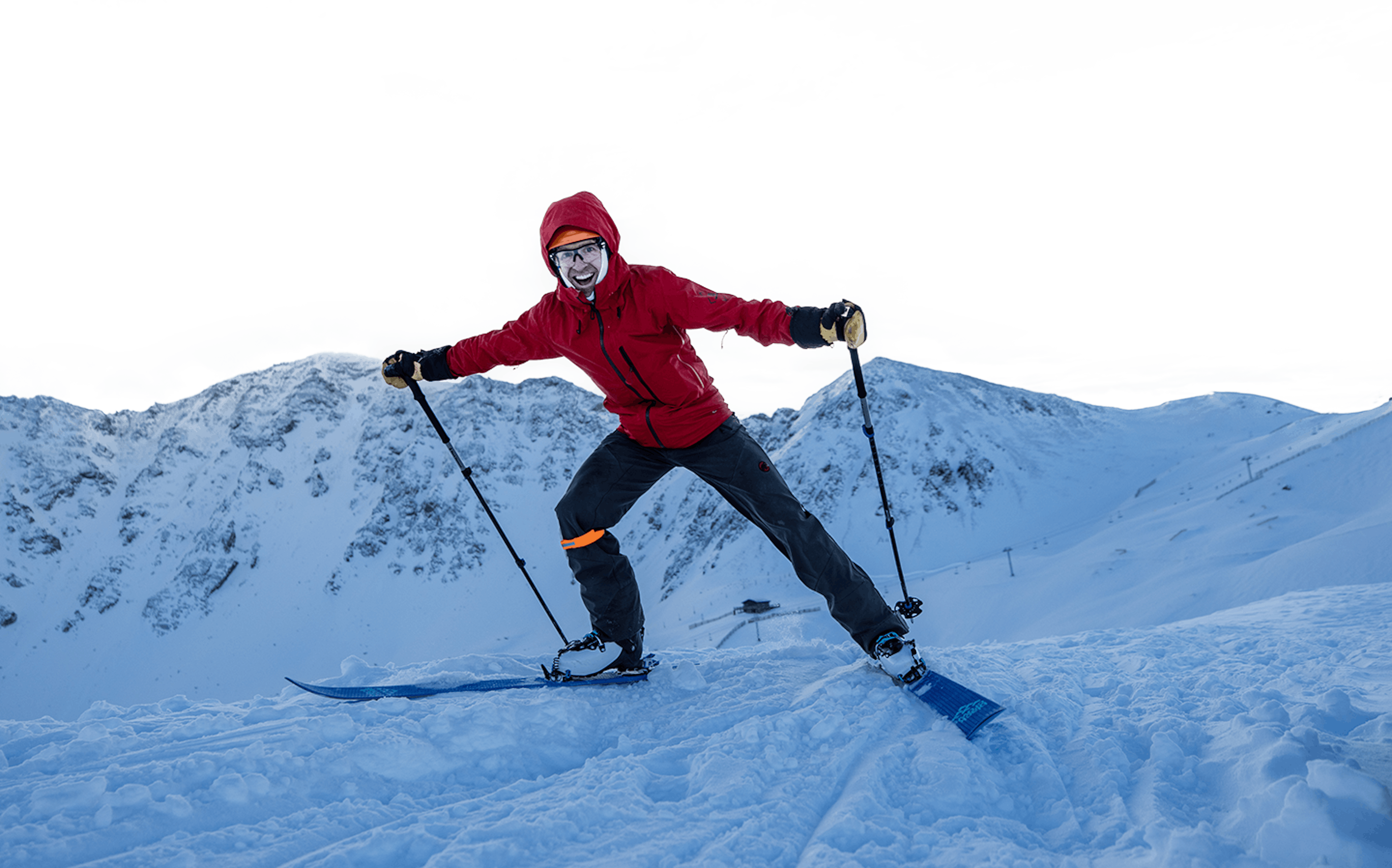 Skier in red jacket enjoying the slopes at Arapahoe Basin in Colorado