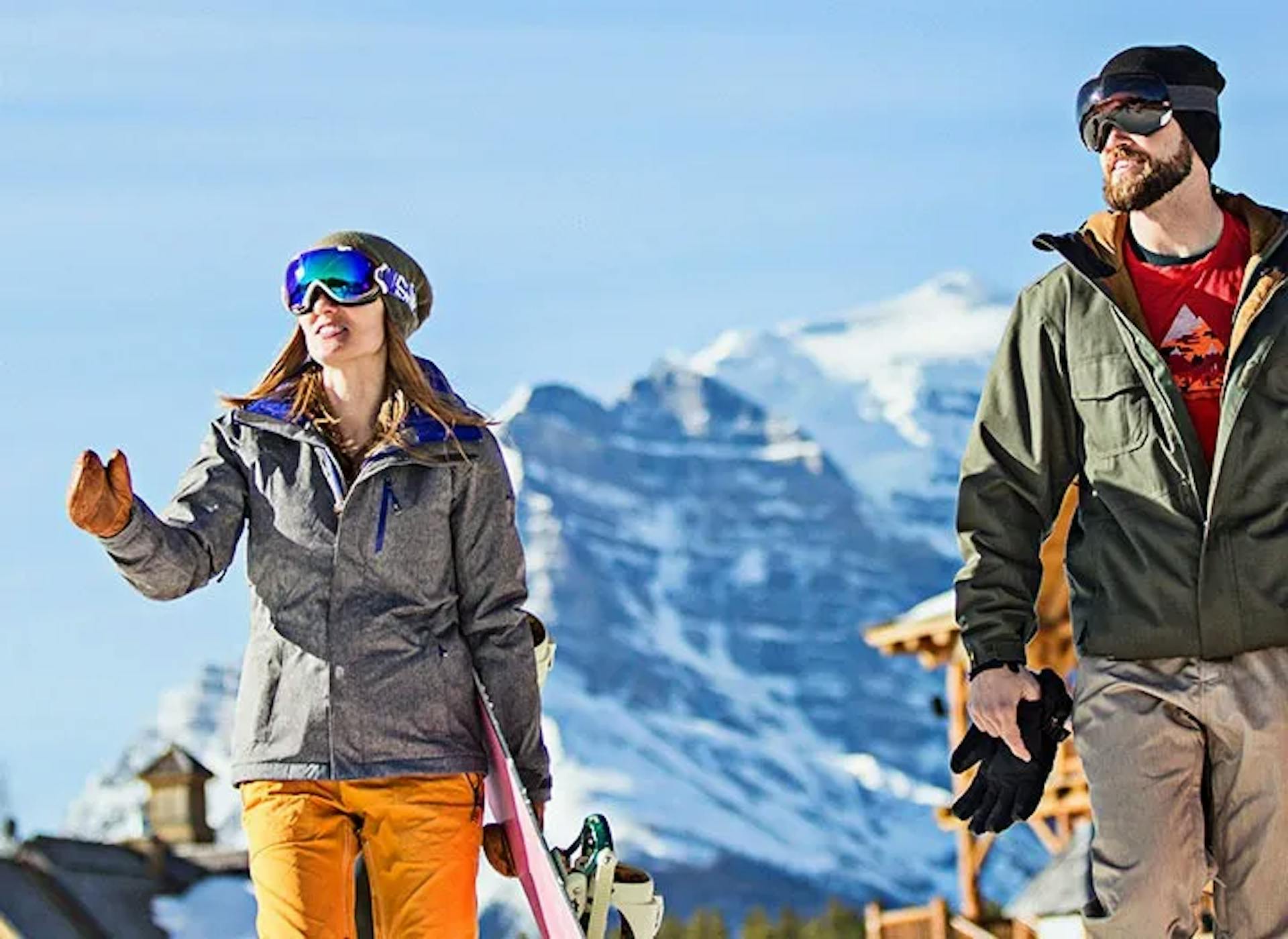 Two skiers laughing on the slopes