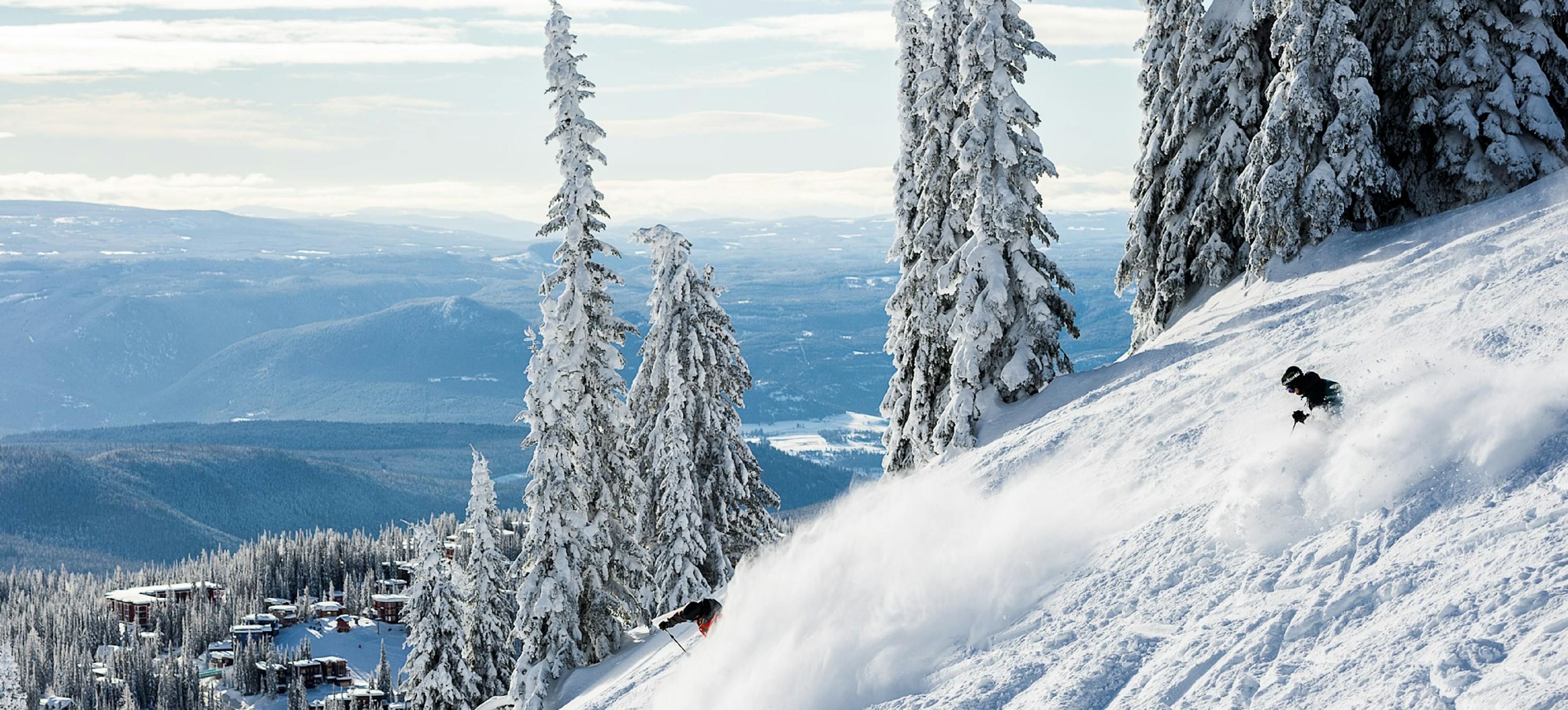 Lone skier of undiscernible gender hitting the slopes of Silver Star Mountain Resort in British Columbia, Canada