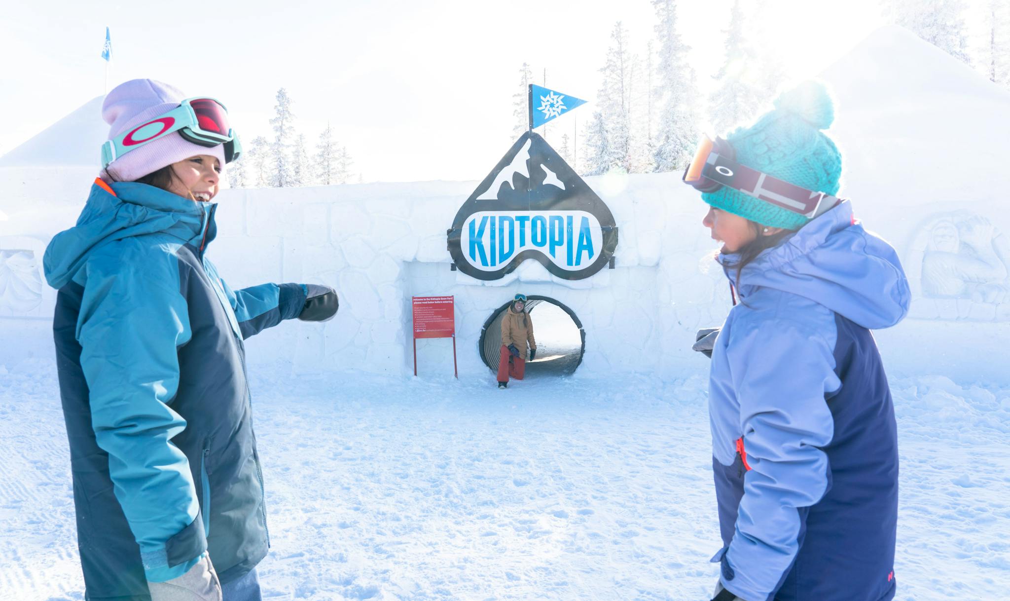 Family plays in the Kidtopia snow fort at Keystone, CO.