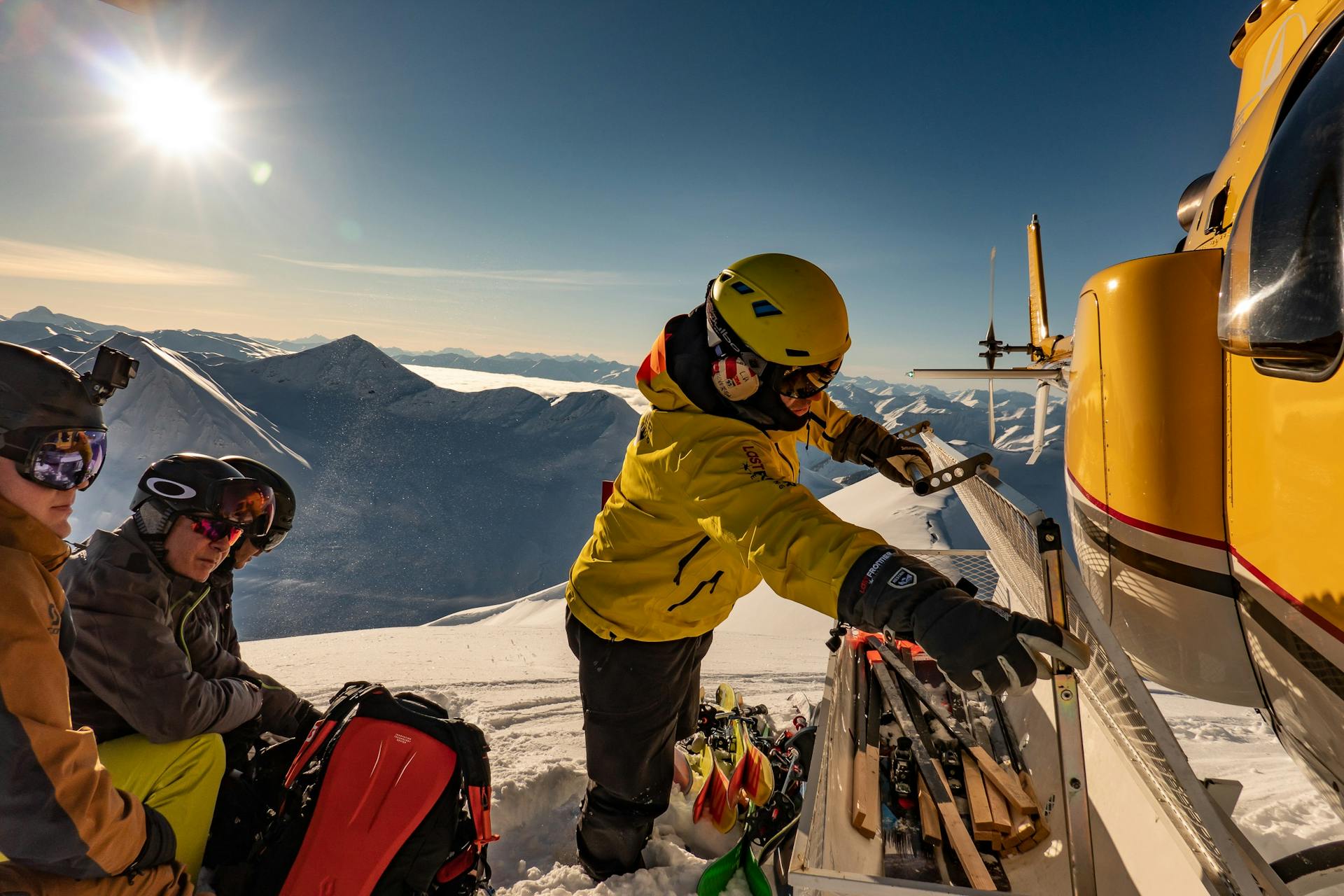 Heliskiing group with Last Frontier waiting for their guide so they can dive into the backcountry.