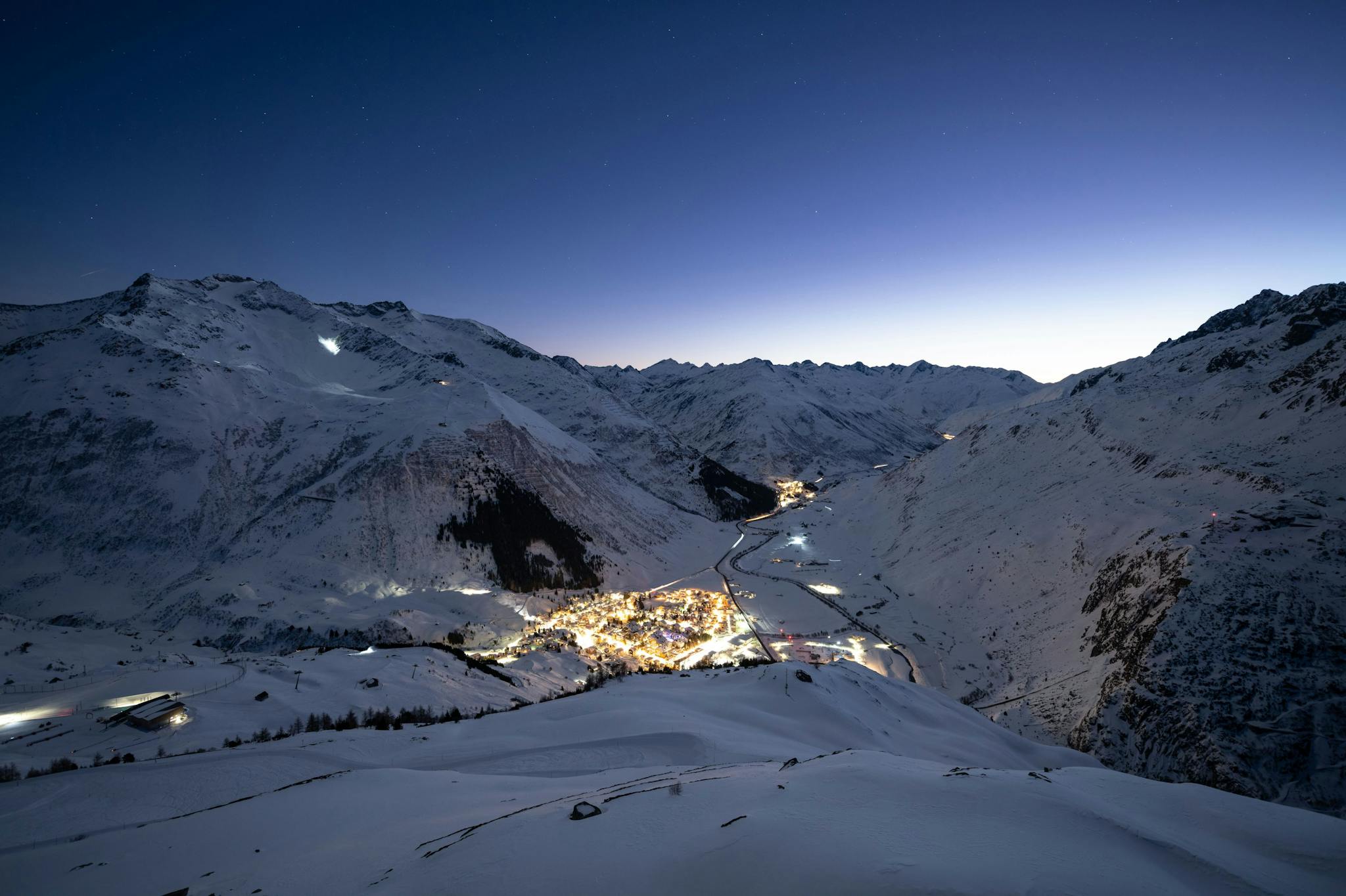 Ursern Valley at night in the wintertime in Andermatt, Switzerland. 