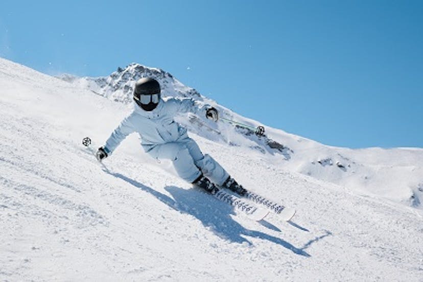  A skier descends a snowy slope