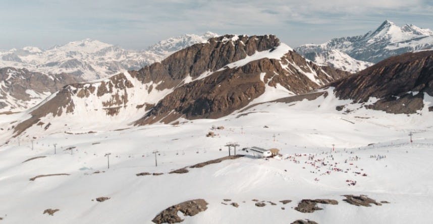 Bird's eye view of the snowy slopes and alpine mountains of Val d'Isère Ski Resort