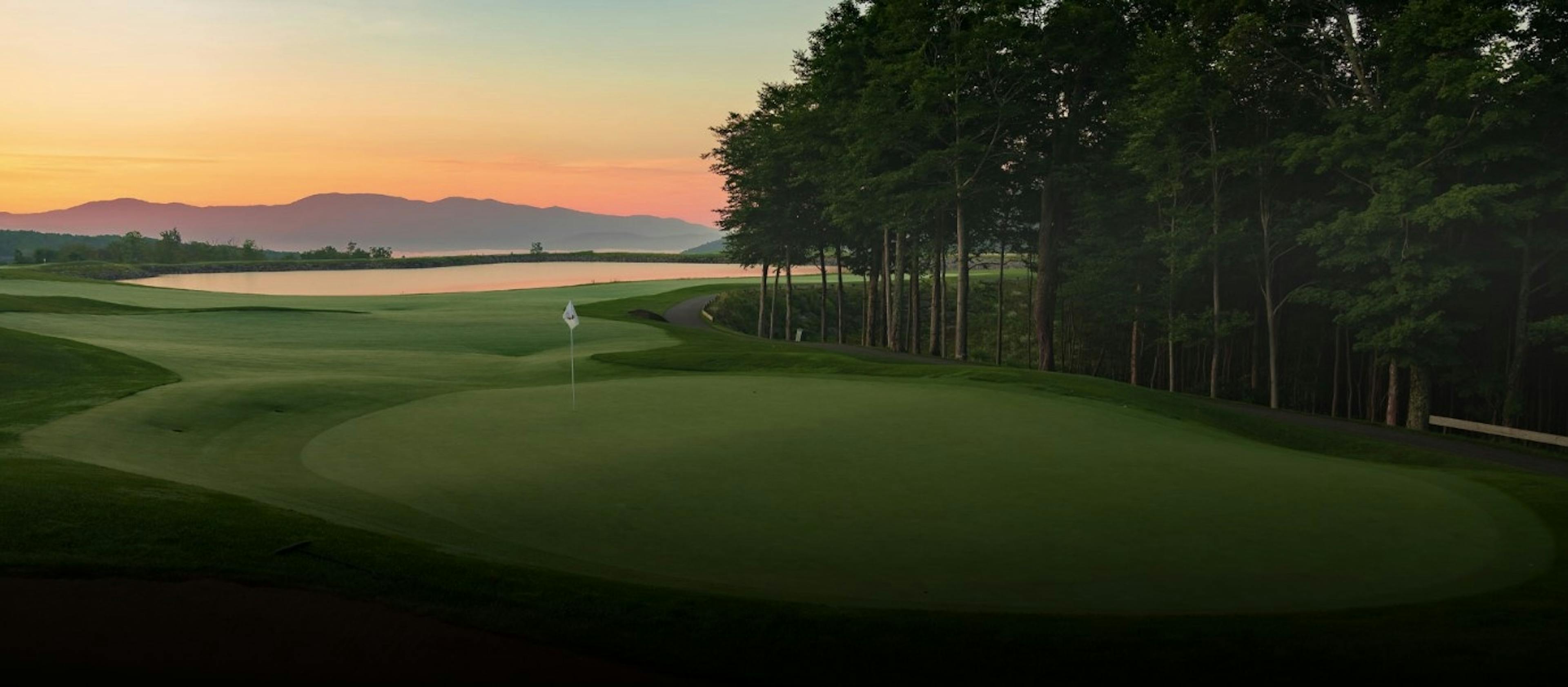 Golf course and lake at sunset at The Club at Spruce Peak