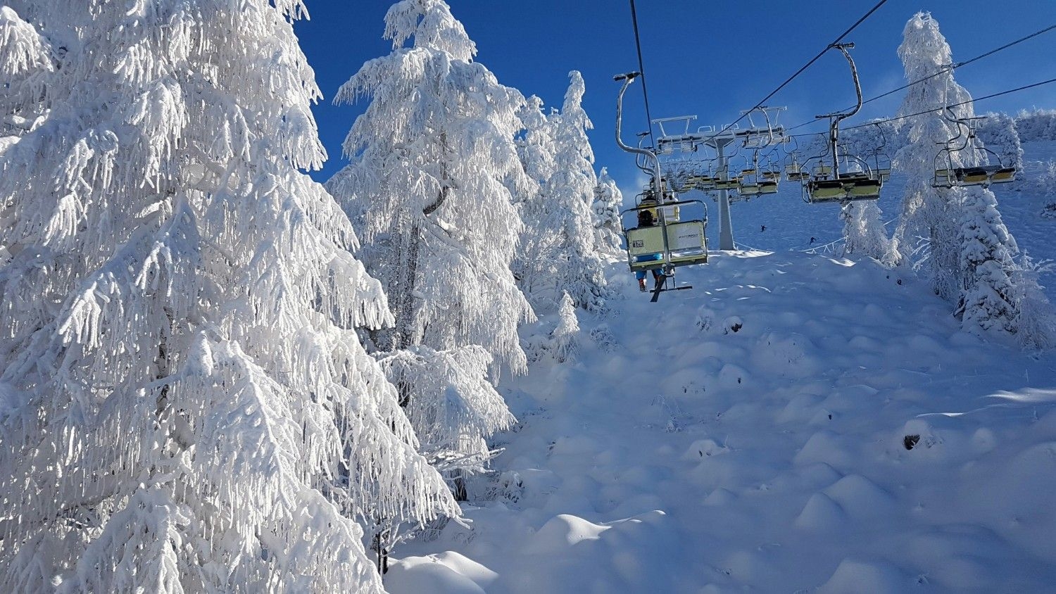 Chair lifts running at Nozawa Onsen in Japan.