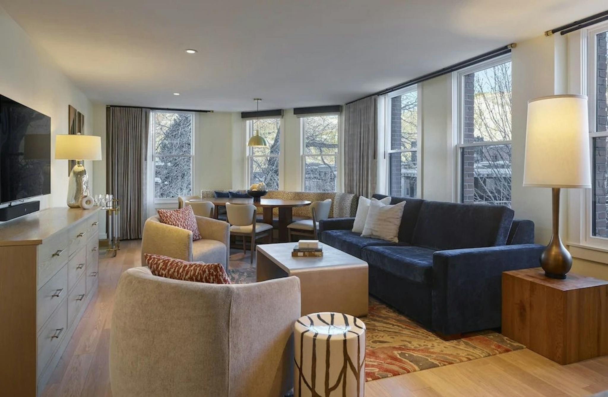 Modern furniture and TV in a living room at the Limelight Hotel