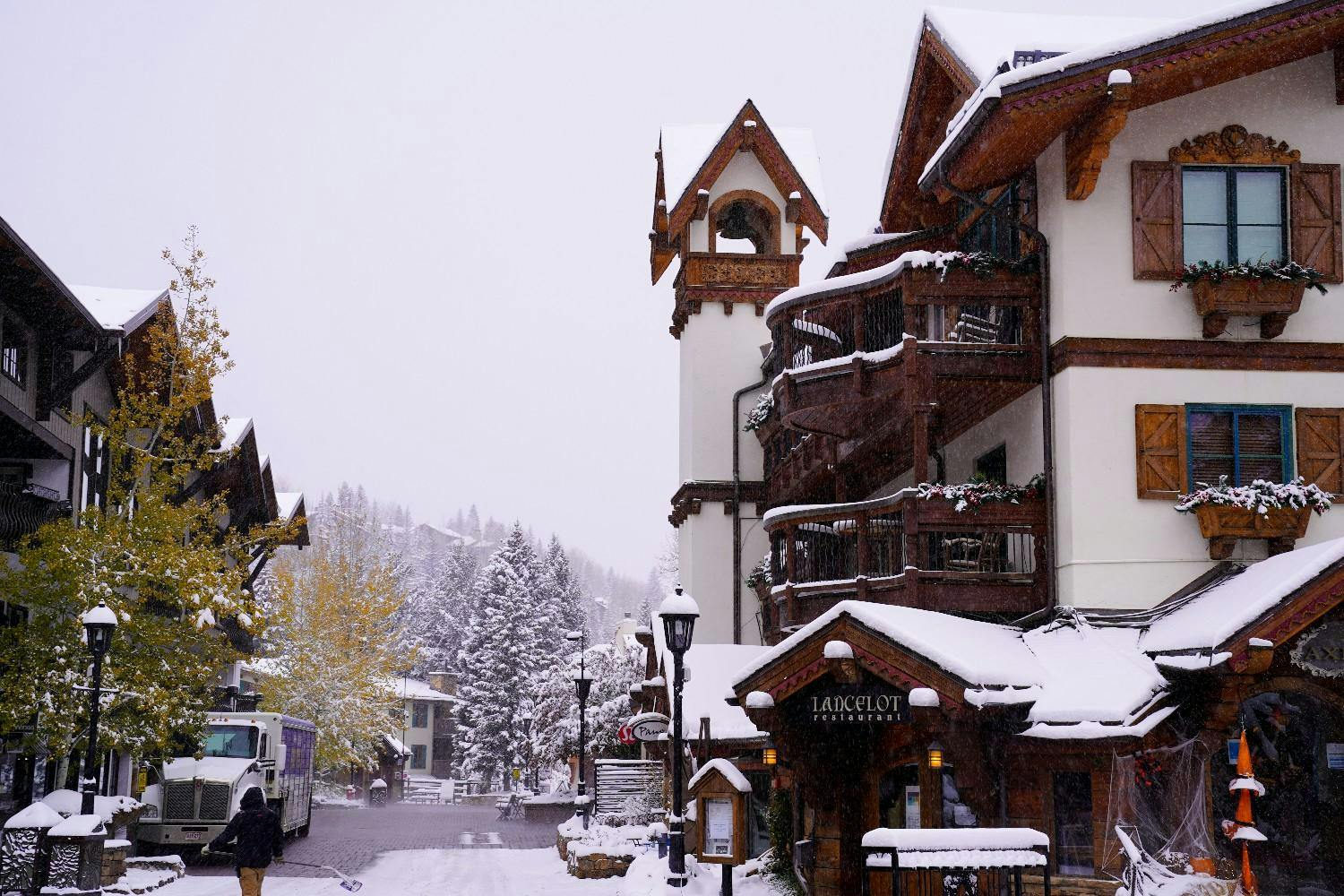 The outside of the Lancelot Vail restaurant covered in snow