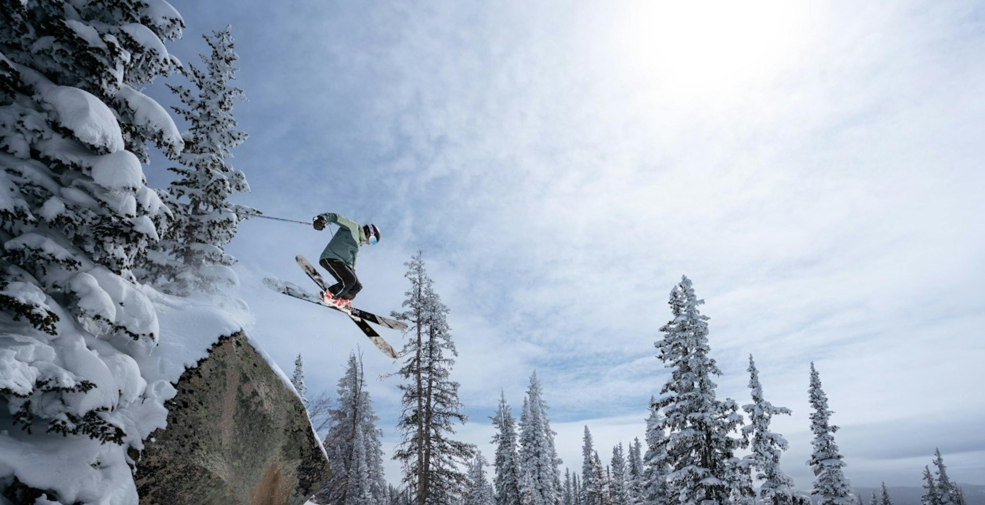 Skier getting major air over a cliff at Steamboat Springs