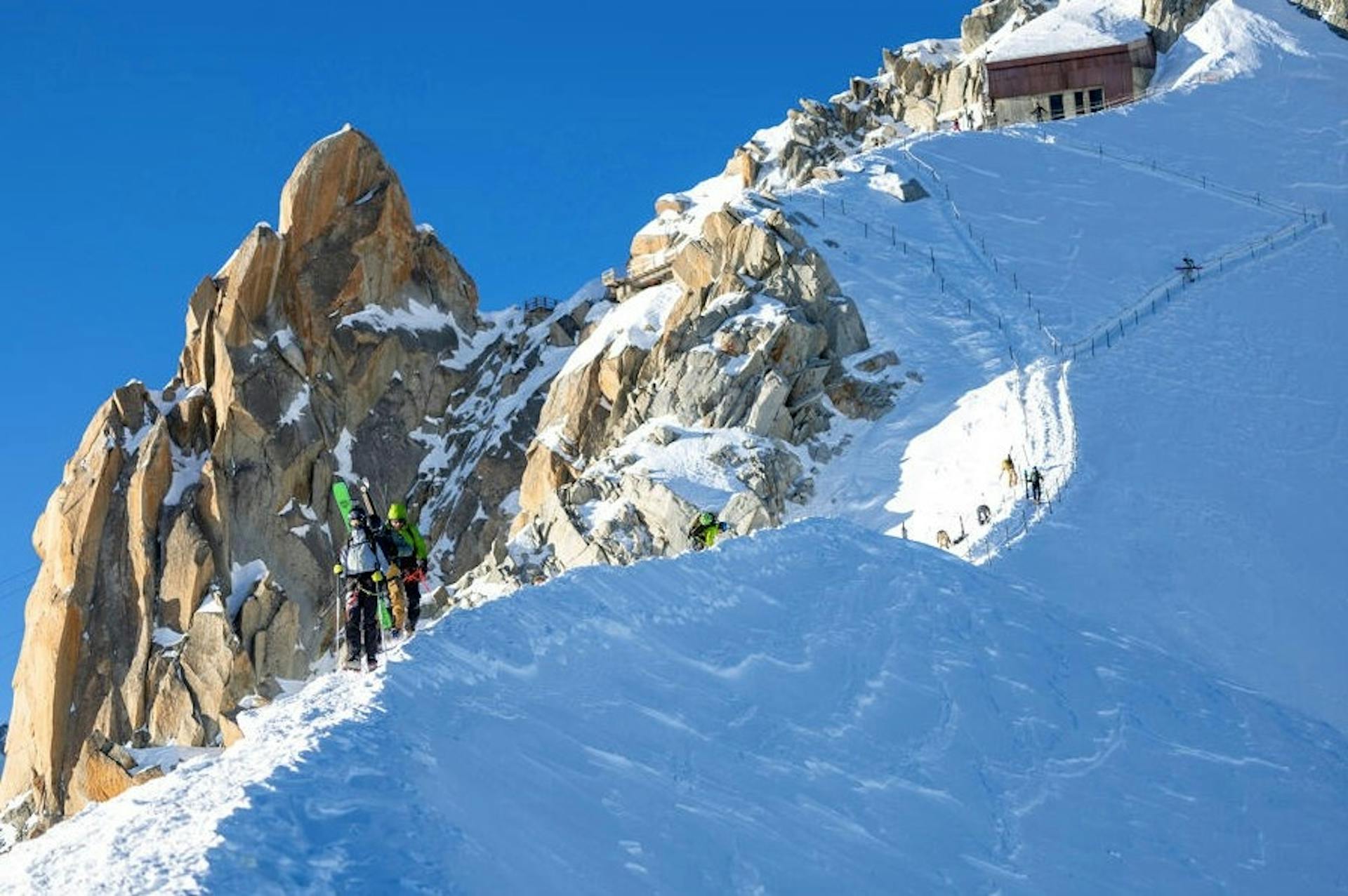two skiers hike along the Vallée Blanche at Chamonix-Mont Blanc ski resort in France