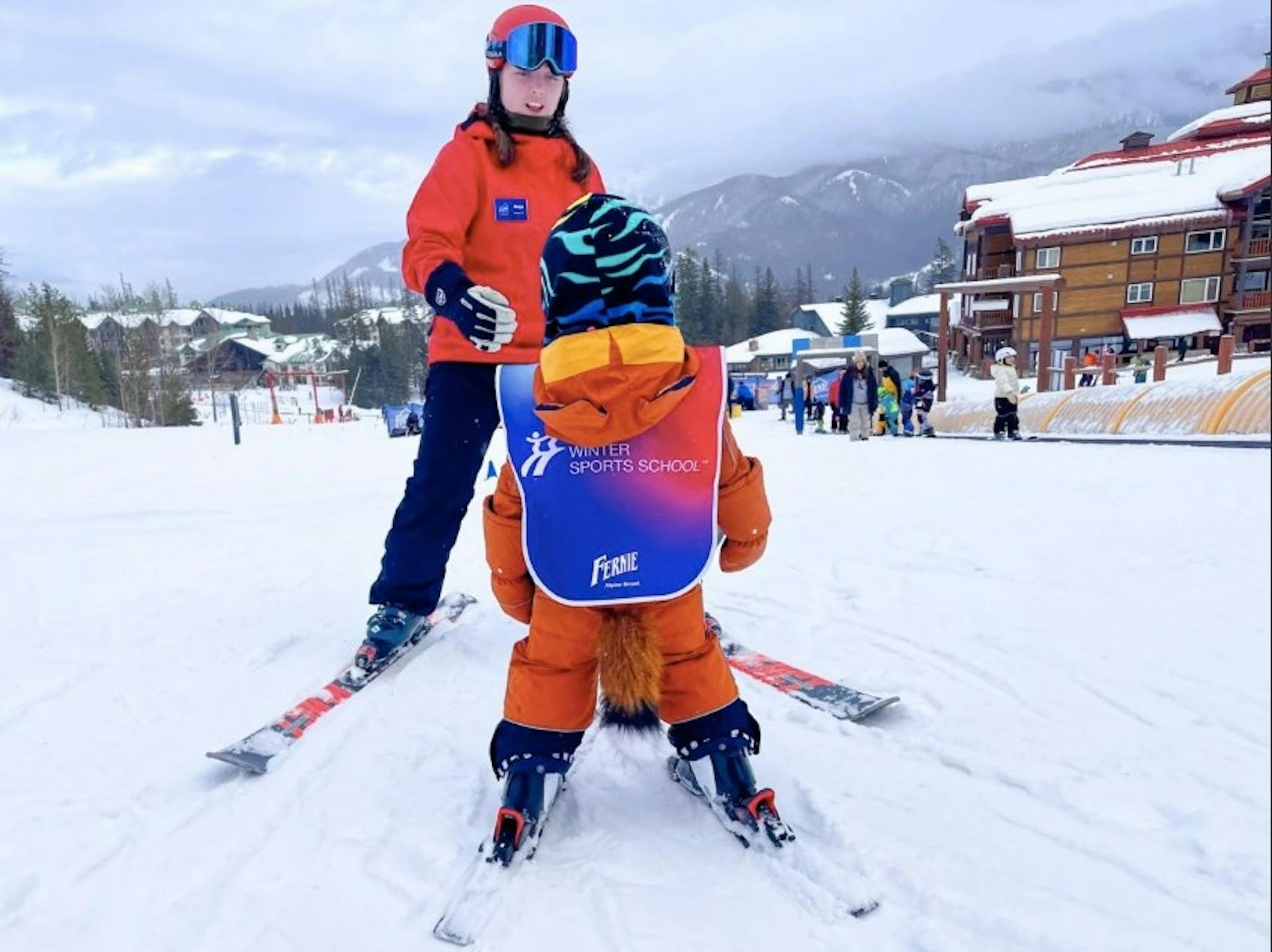 Fernie ski instructor teaching a child to learn how to ski on the bunny slope at Fernie Resort