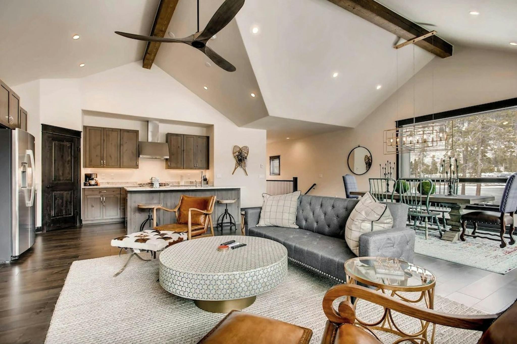 The classy modern living room and kitchen inside one of the condo units at Keystone’s River Run Townhomes 