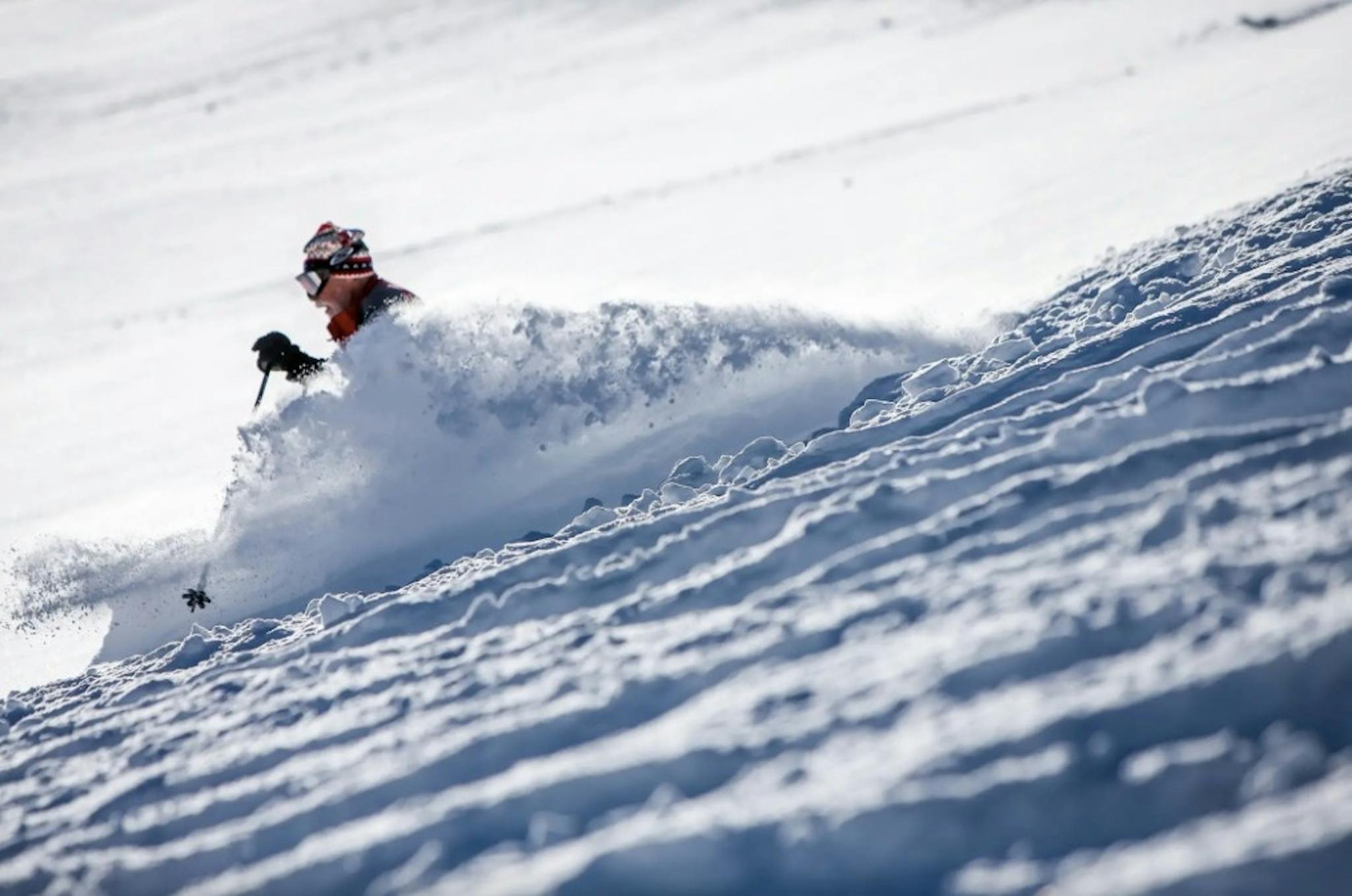 David Van Dame aka "Farmer Dave" skiing on powder-filled slopes at Alta Resort
