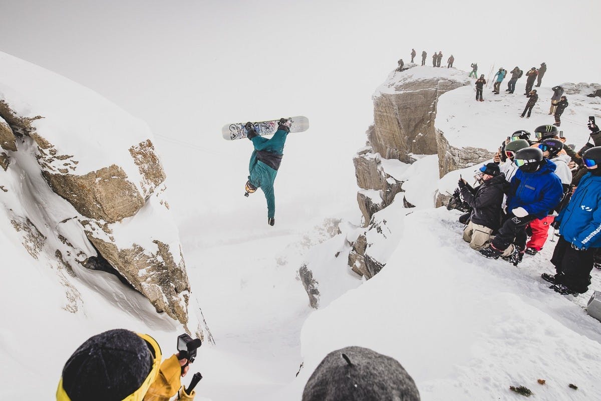 Snowboarder backflipping into Corbet’s Couloir at Jackson Hole Resort
