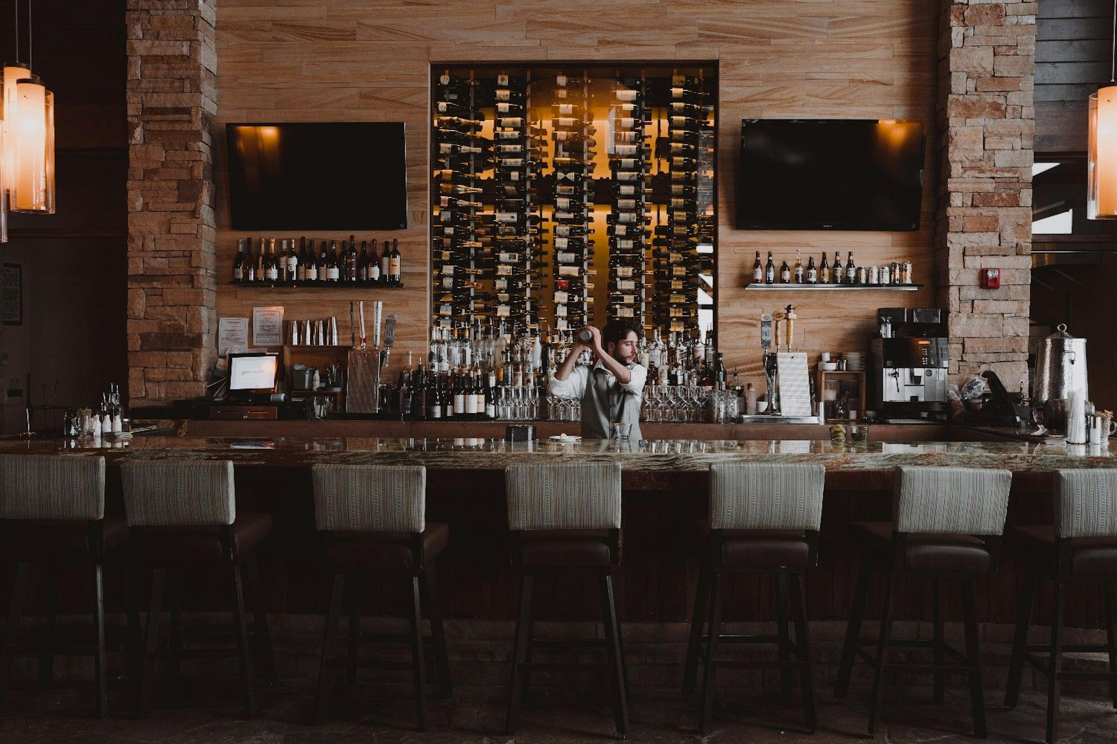 A bartender preparing drinks at The 10th in Vail, Colorado.