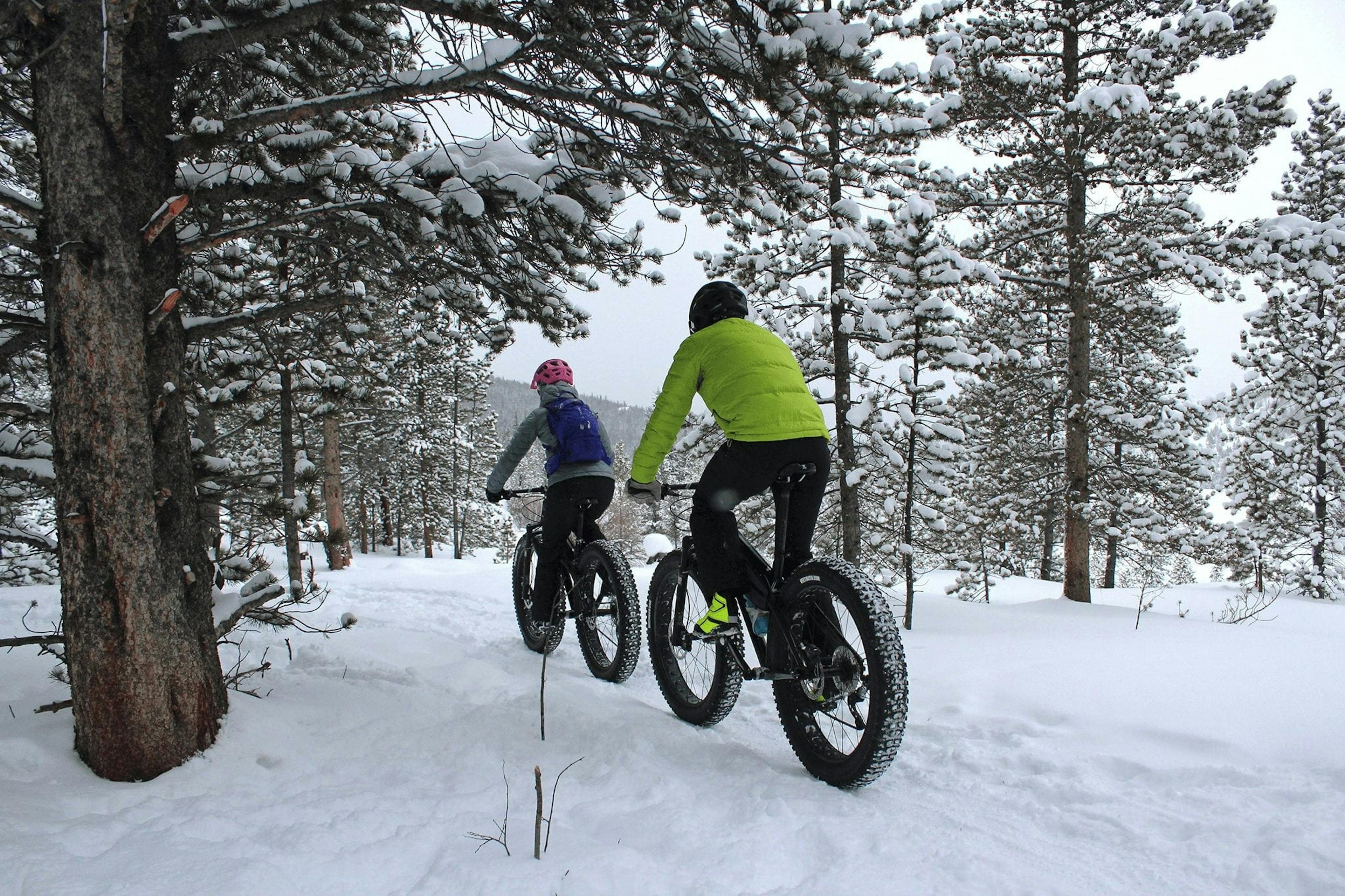 Fat biking couple at Breckenridge in Colorado, USA.