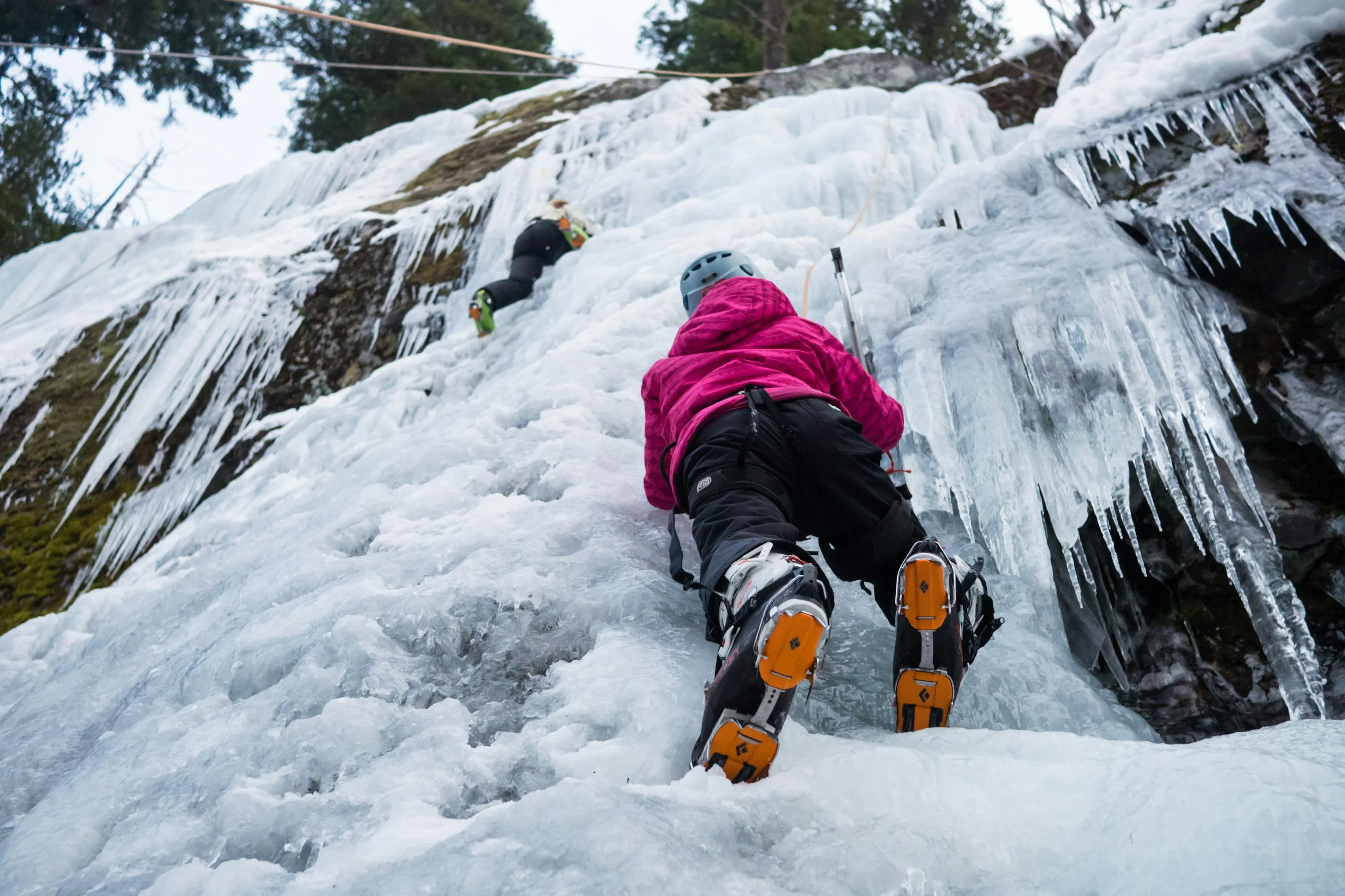 A young woman ice climbing in Whistler