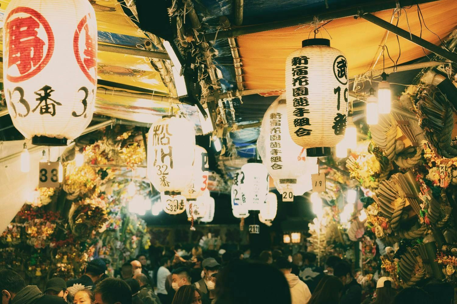 Japanese market crowded with people and Japanese lanterns