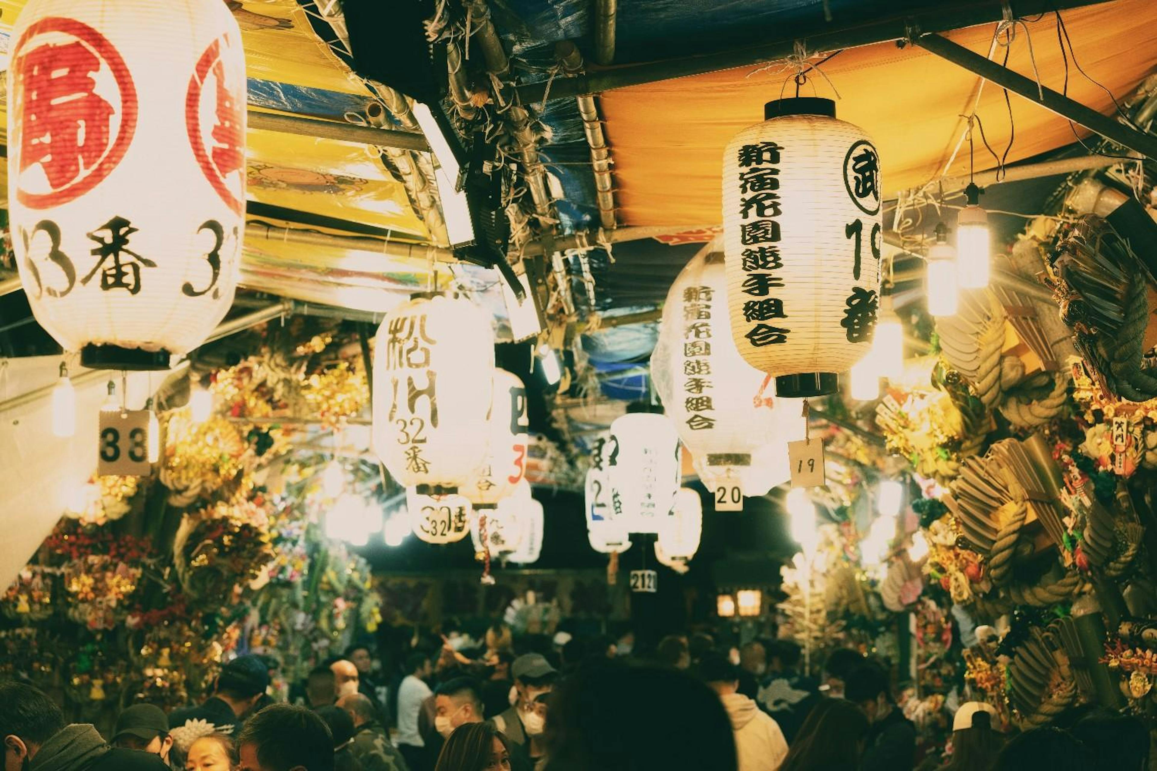 Japanese market crowded with people and Japanese lanterns